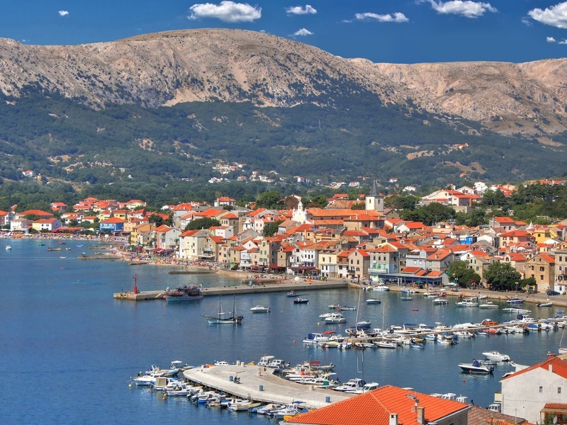 Baska Harbour with a pebble beach and historic village
