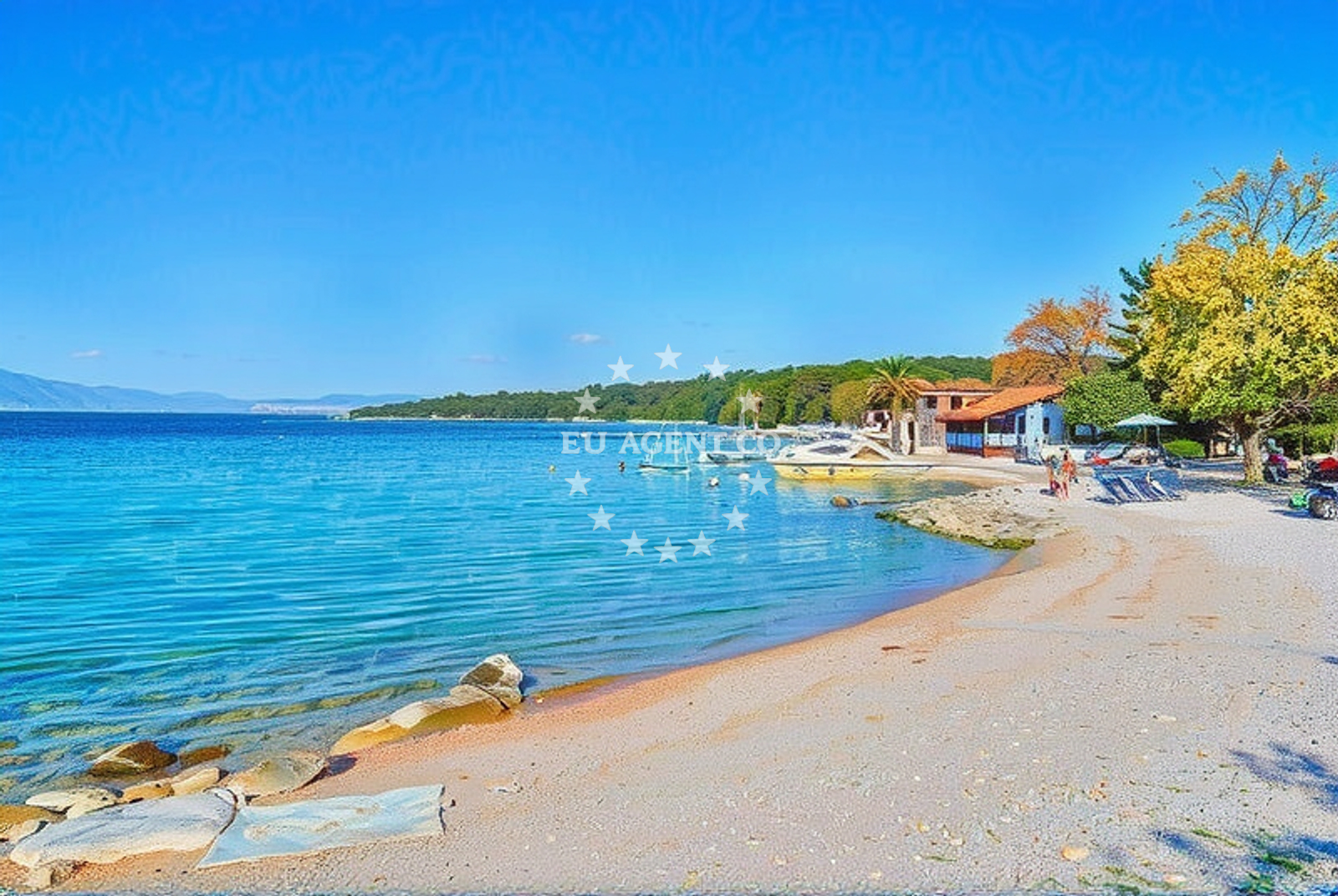 Njivice Harbour with boats moored at the pier