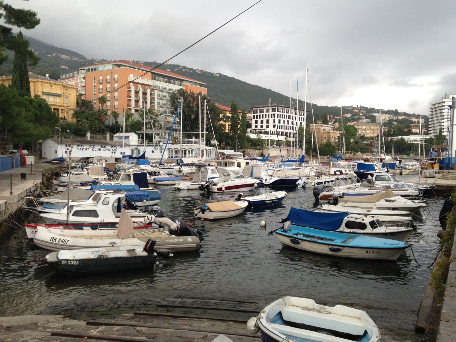 Opatija Harbour with boat lift, fuel station, and nearby Hotel Ambassador.