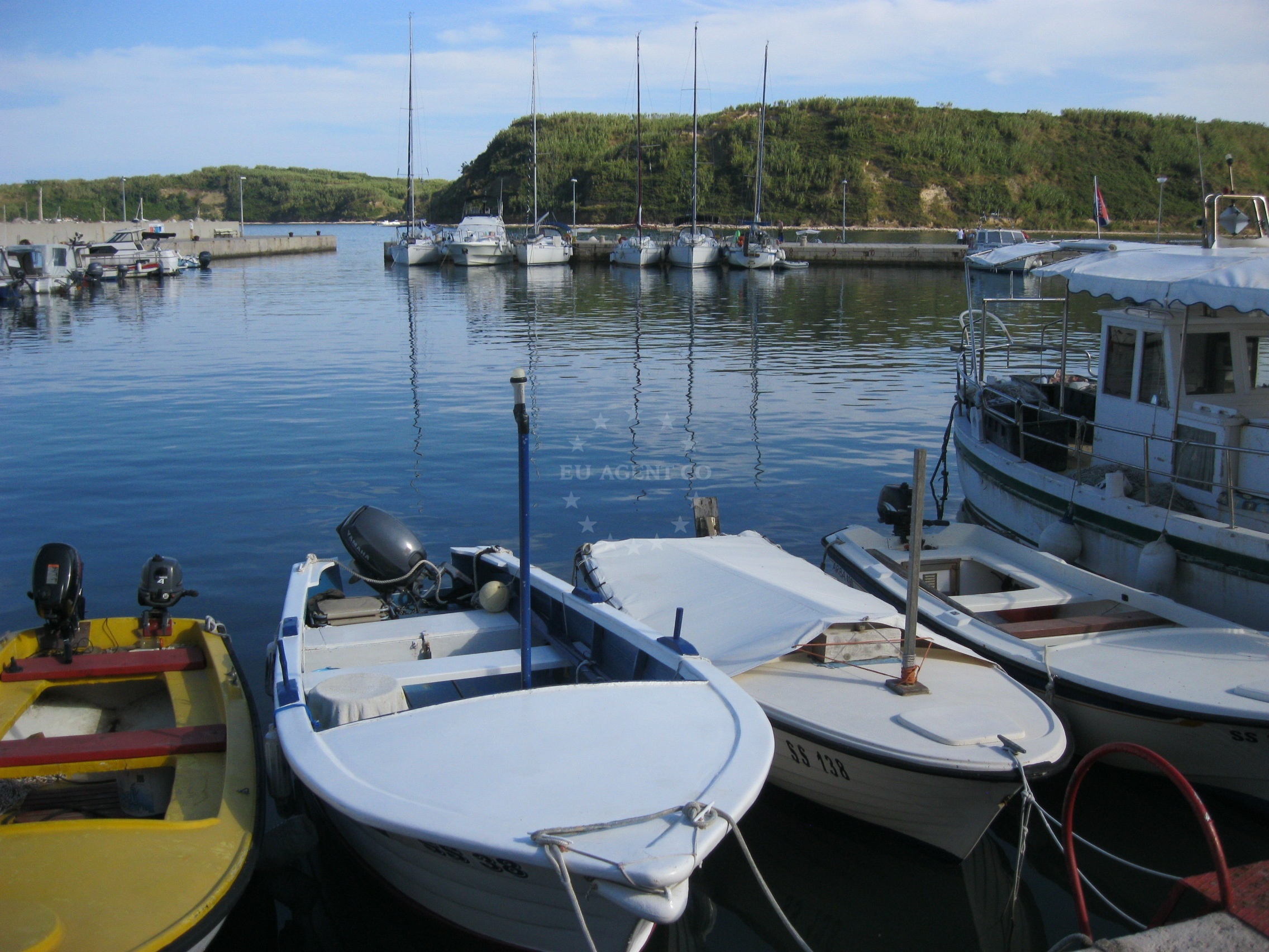 Narrow harbor channel with marked shoal and buoy near Susak