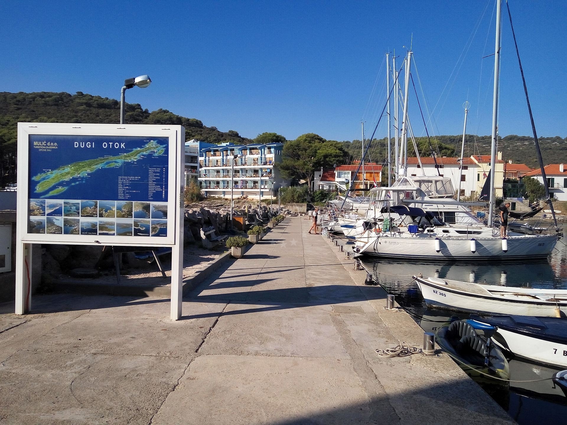 Bozava Harbour breakwater with moored yachts