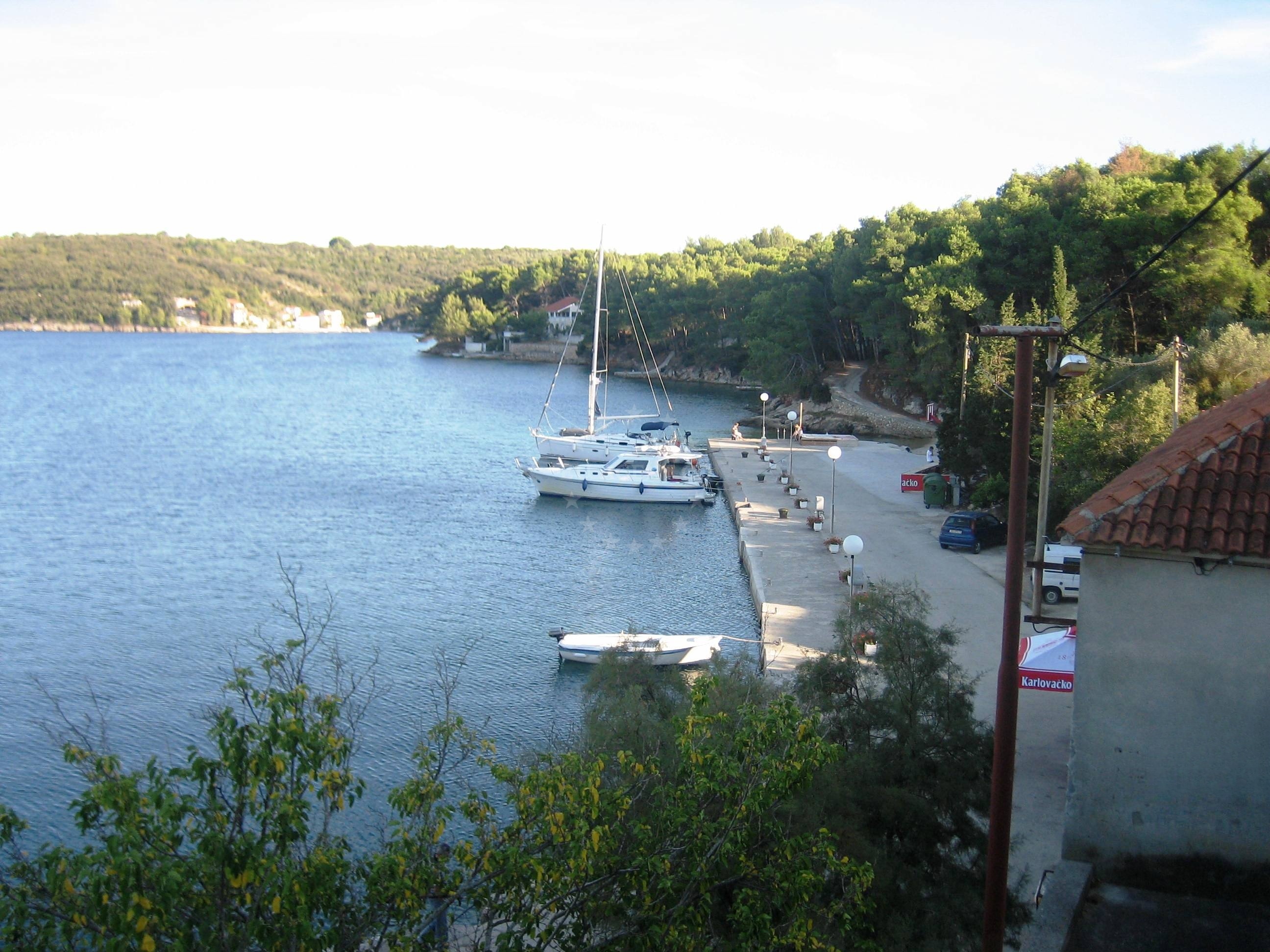 Brbinj Harbour with moored yachts and jetty