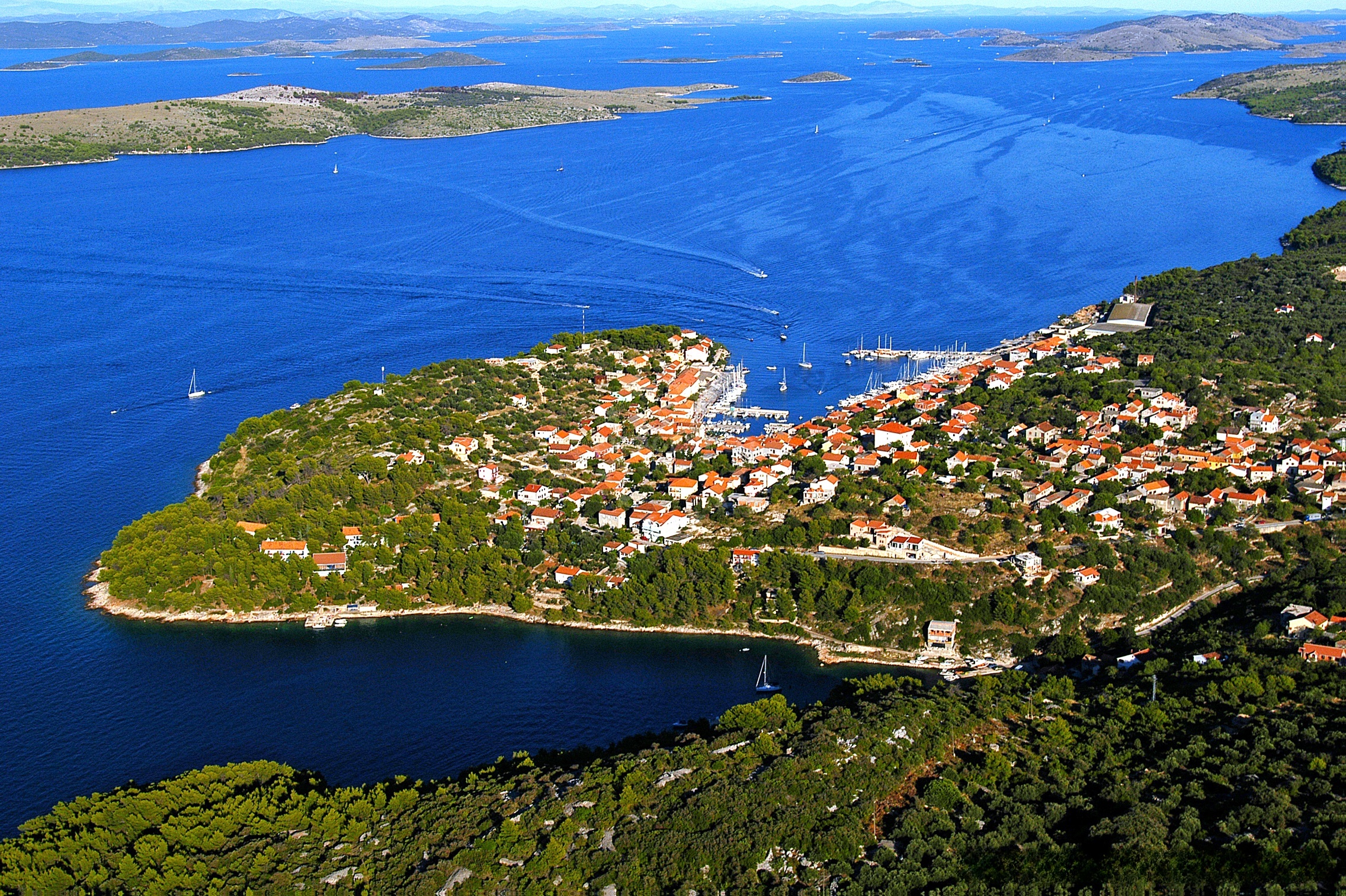 Sali Harbour entrance with breakwater and village houses