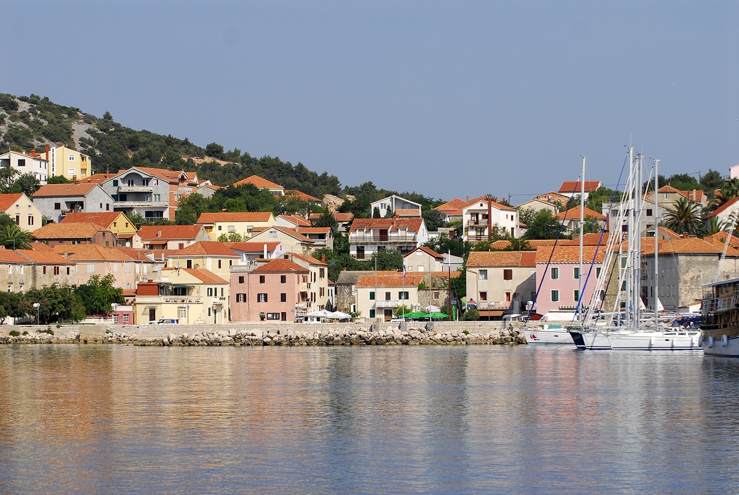 Lavdara Island and Bluda Point lighthouse viewed from Sali Harbour
