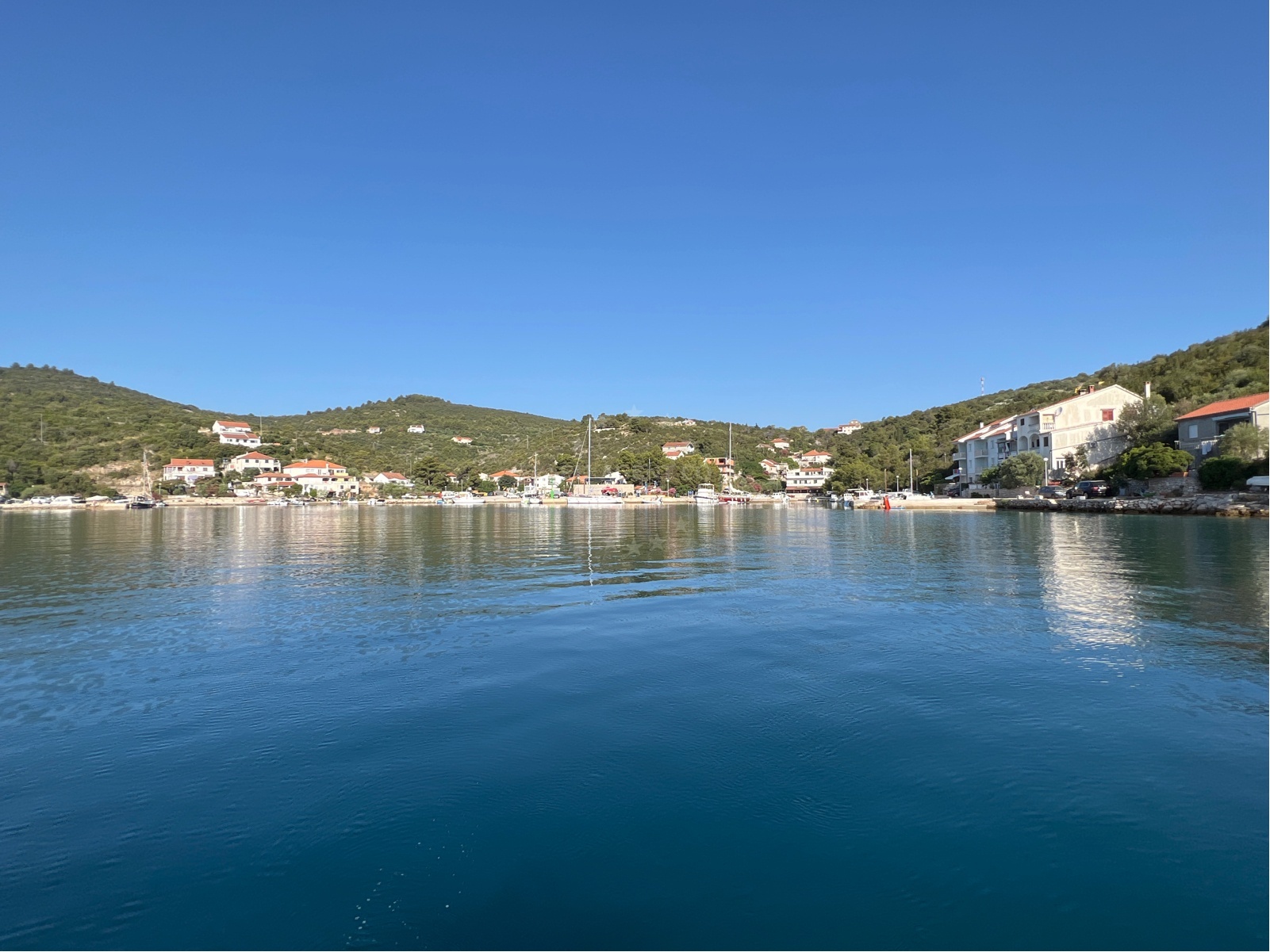 Boat approaching Zaglav Harbour with nearby anchorages