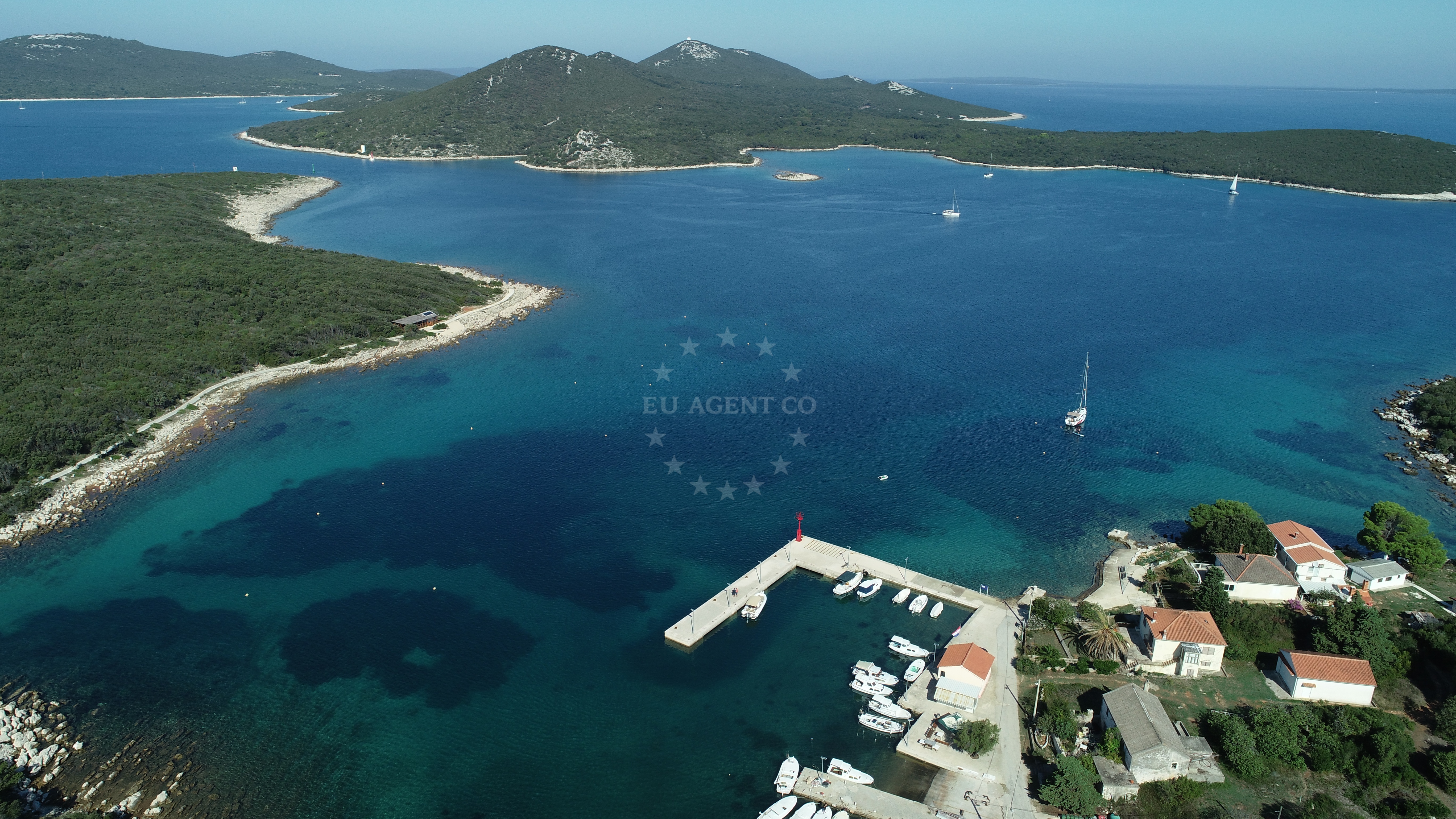Zapuntel Harbour, Molat, Croatia: A quiet fishing port with mooring lines and traditional boats