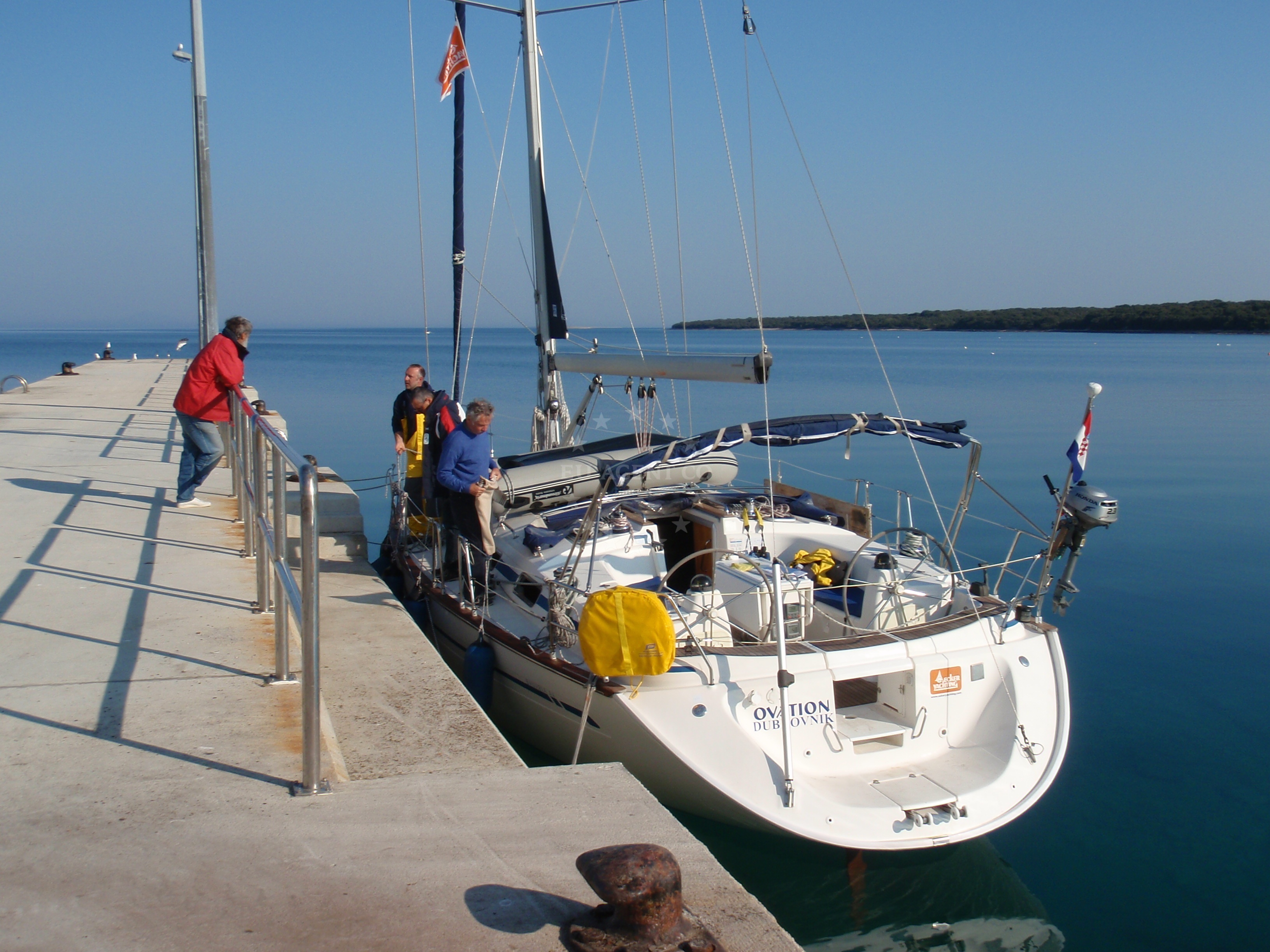 Olib Harbour entrance with mooring buoys and ferry terminal