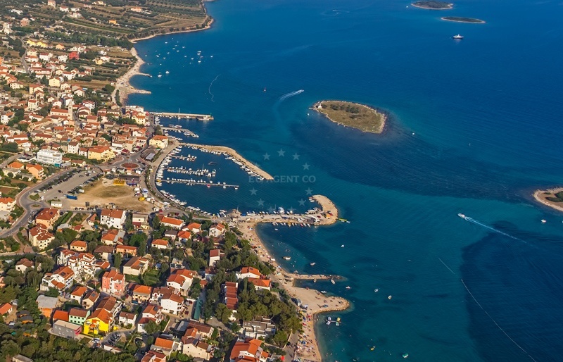 Pakostane Harbour with three short pontoons anchored in the bay, North Dalmatia, Croatia