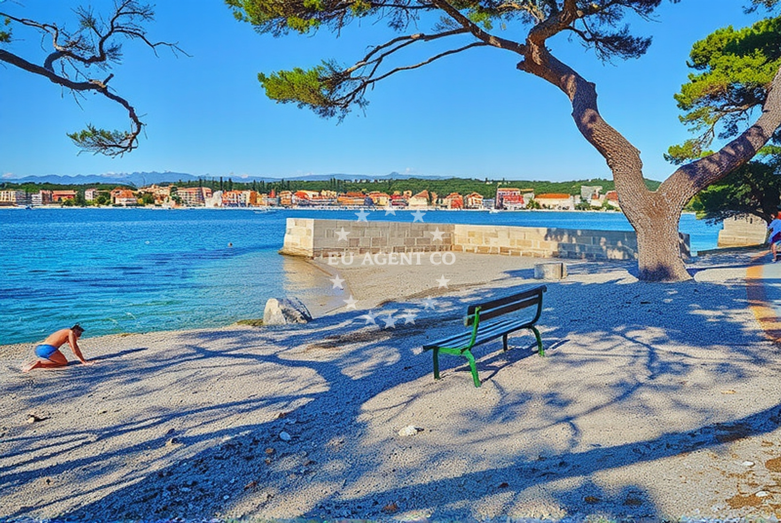 Beach at Petrcane with clear waters and rocky coastline