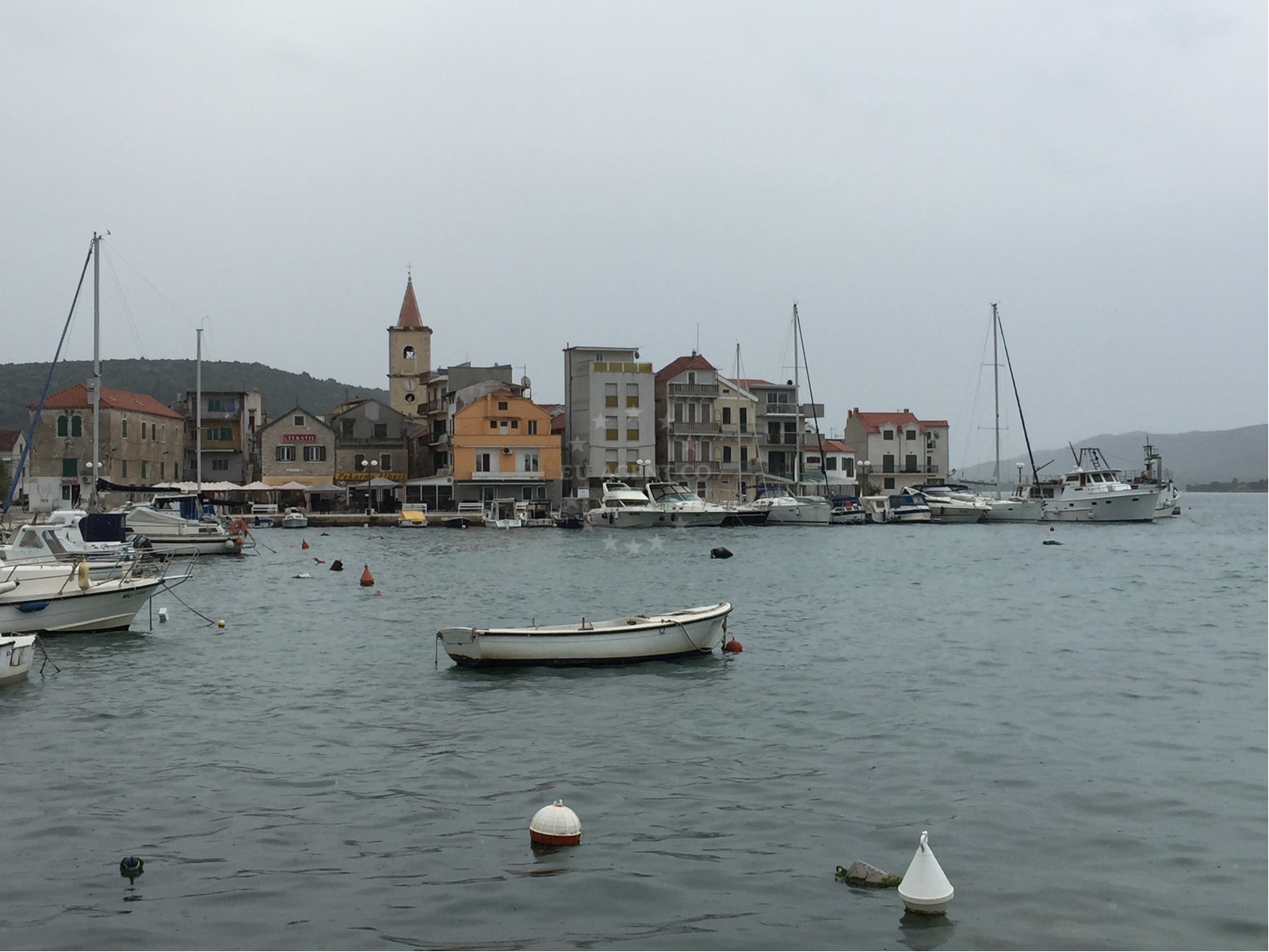 Pirovac Harbour with church bell tower and marina