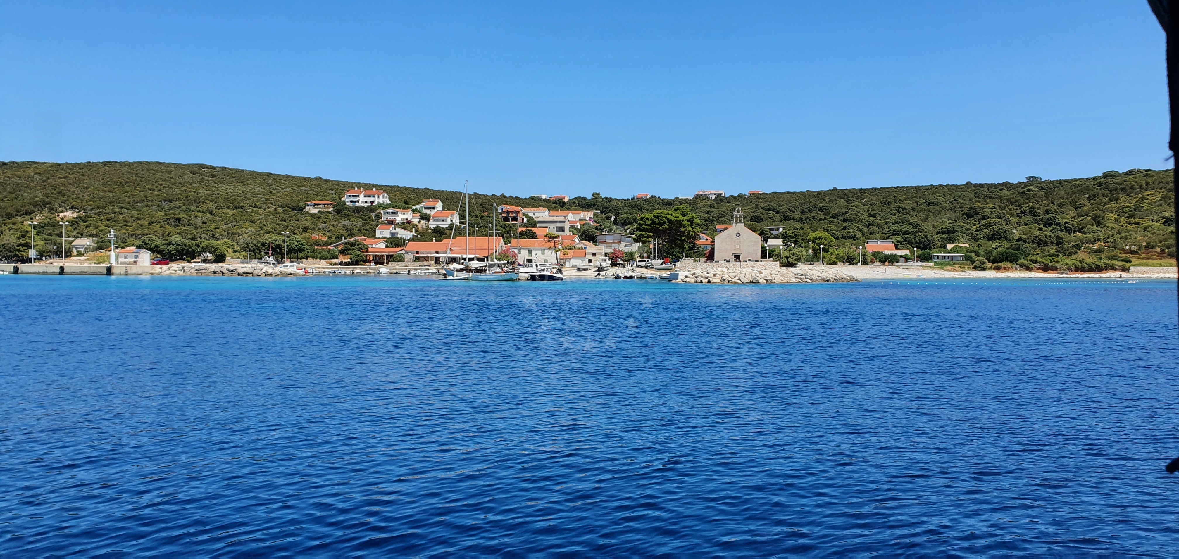 Shallow waters near Masarine island with buoy markers