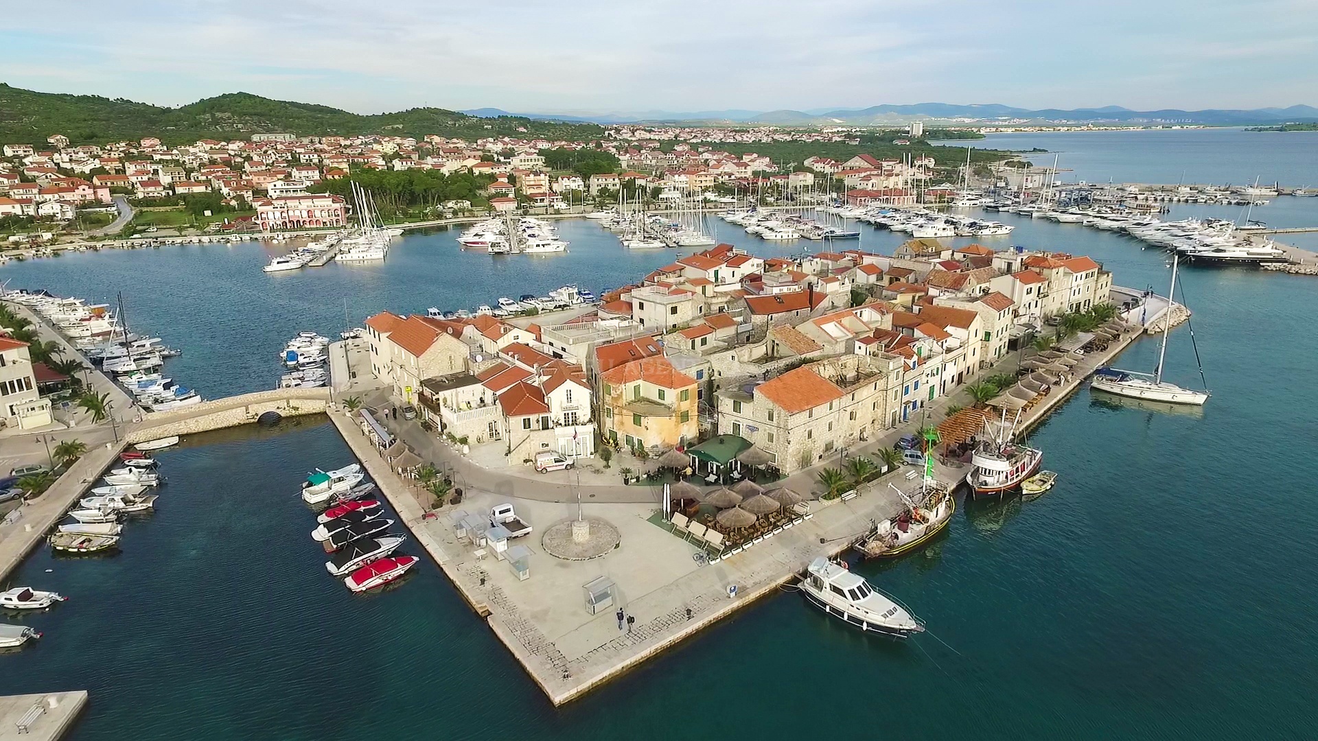 Tribunj Harbour with yachts docked at the town quay
