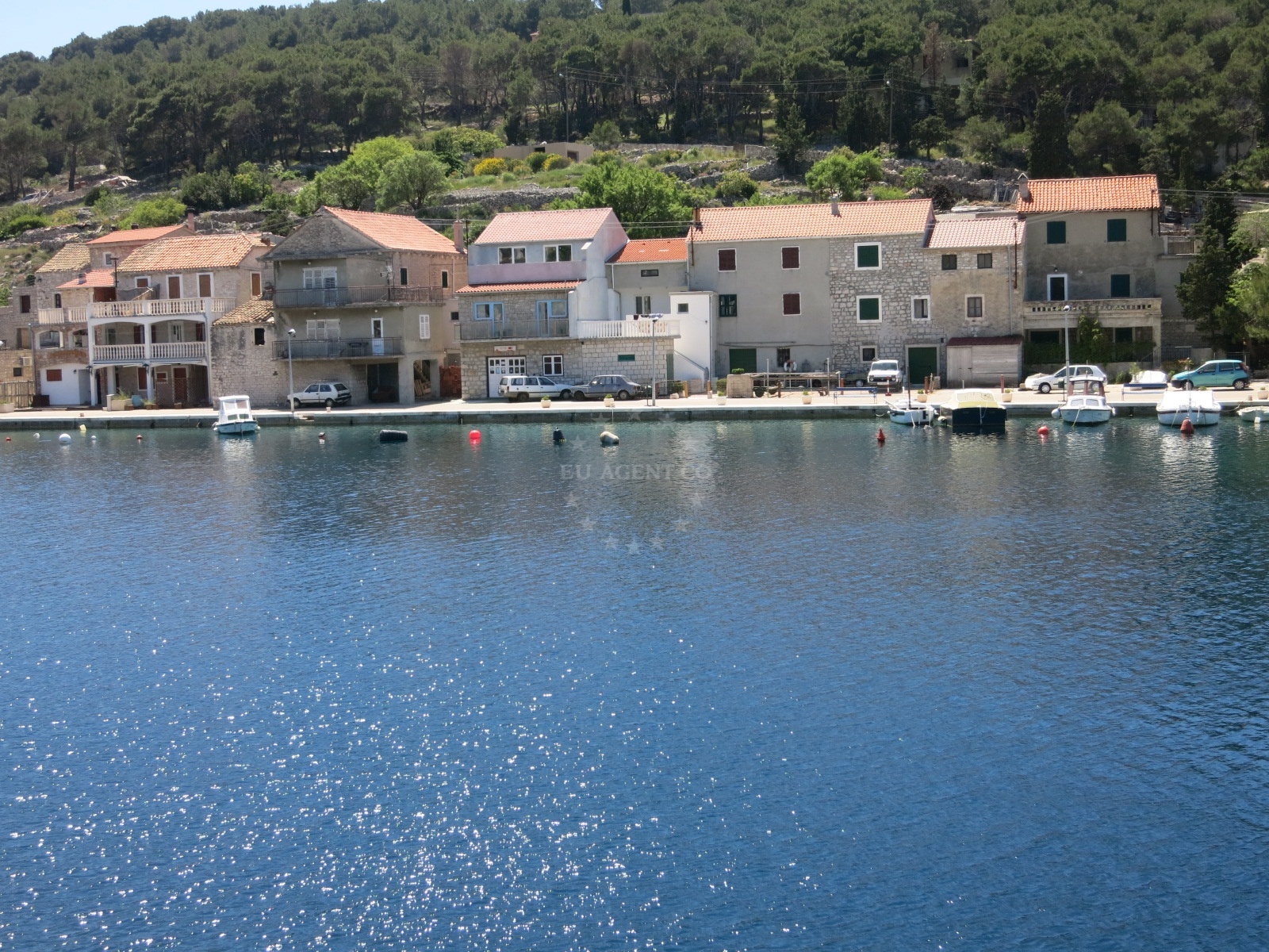 Sailboats moored at Muna Harbour