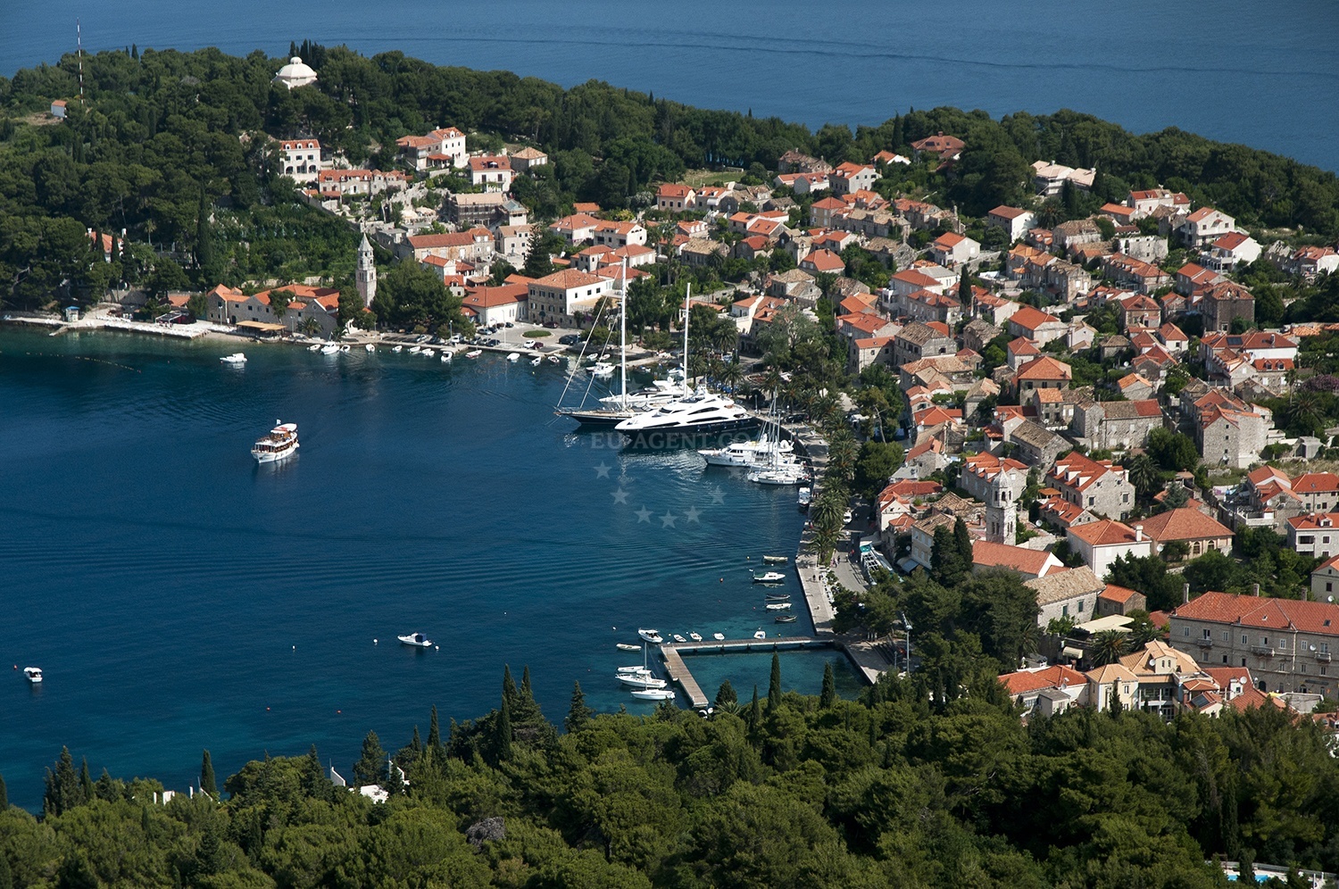 Cavtat Harbour entrance with lighthouse on Sv. Rok Point