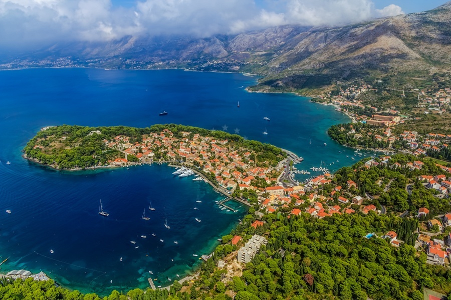 Yachts berthing alongside Cavtat Harbour with depth markers