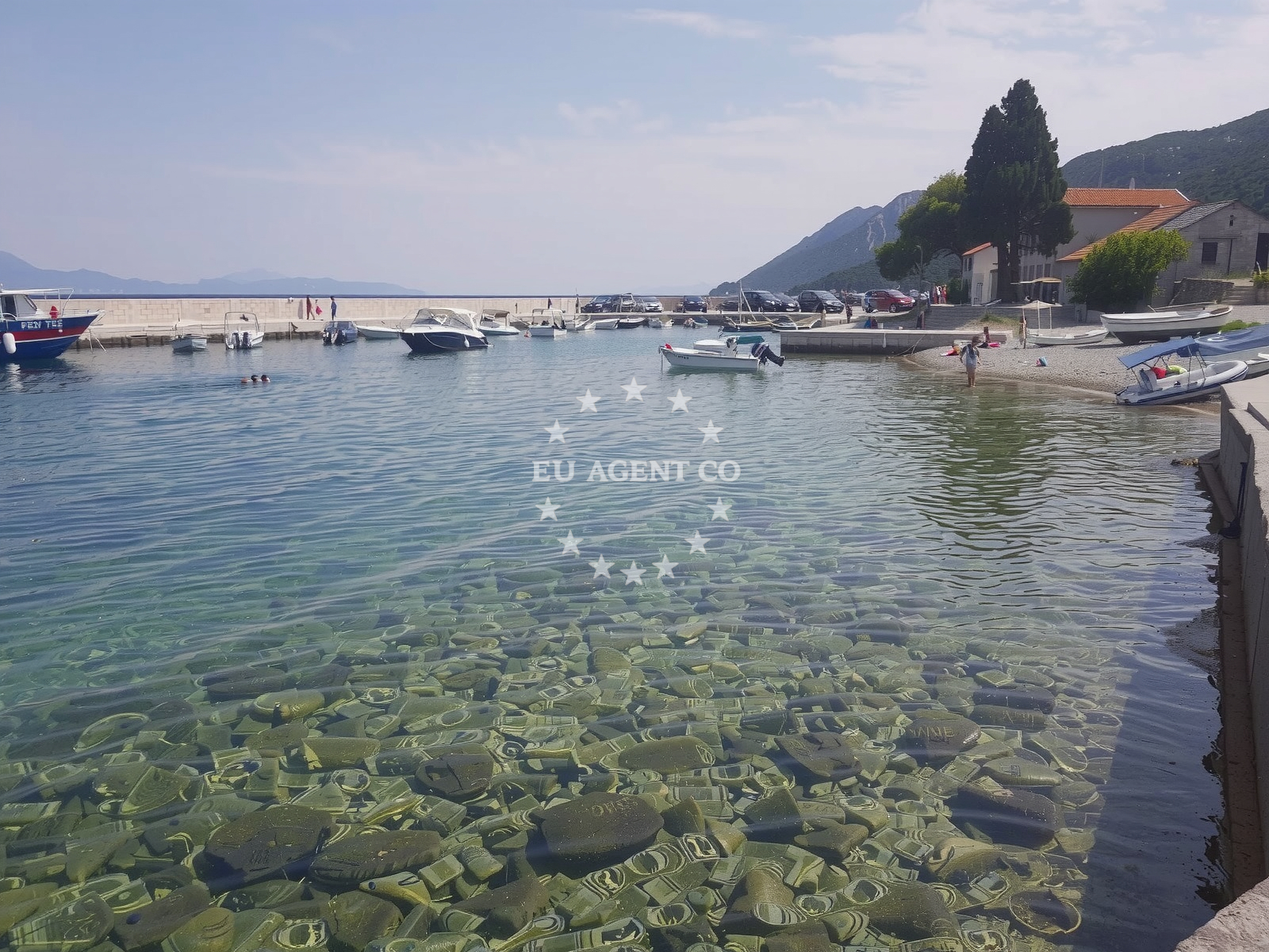Duba Harbour in Duba Pelješka, South Dalmatia, Croatia, with yachts berthing and nearby beaches visible