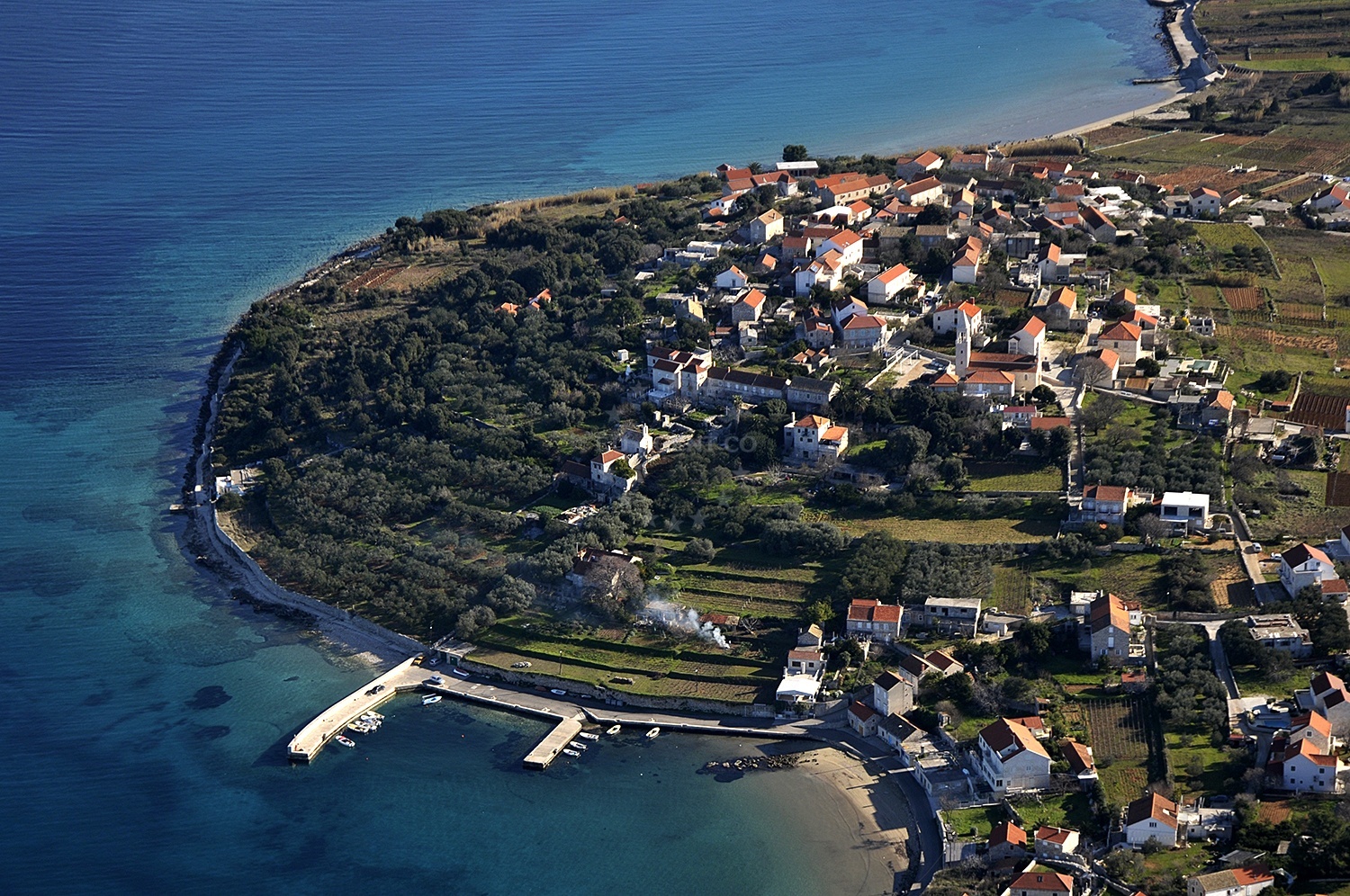 Tatinja Harbour entrance with shallow waters and nearby islets