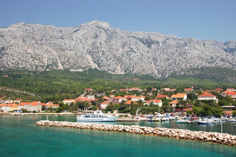 Orebic Harbour entrance with mooring lines and Pelješac Peninsula backdrop