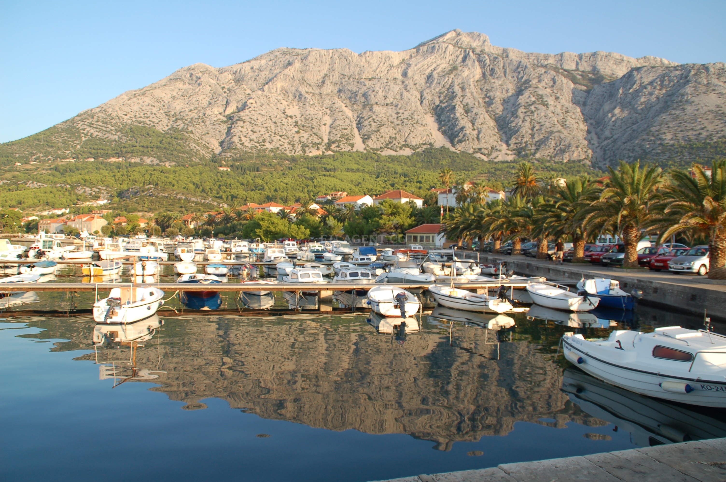 Yachts berthed at Orebic Harbour with Korčula Island in the distance