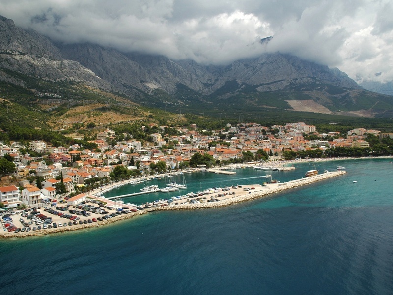 Yacht moored at Marina Baska Voda near the harbor light