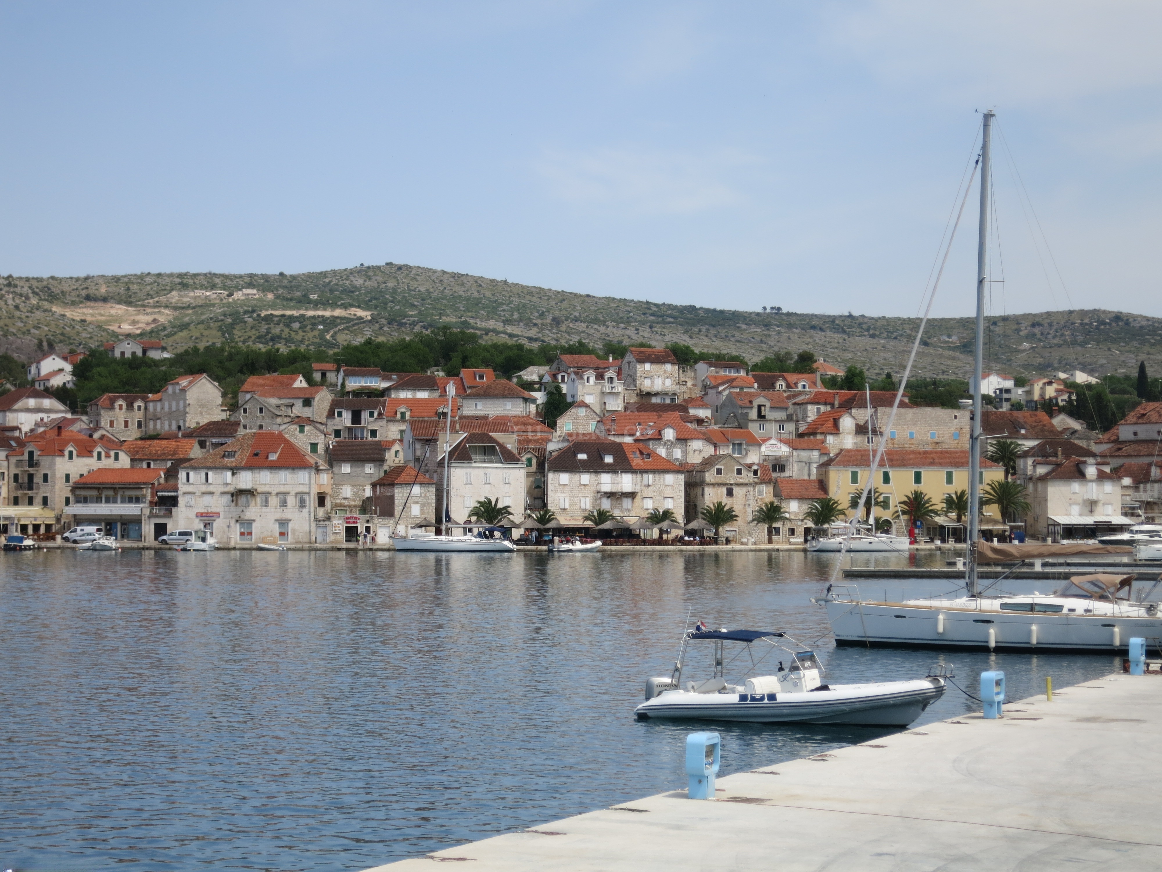 View from Marina Milna Kanarija, Brač: Sunset over the Adriatic with yachts anchored nearby.