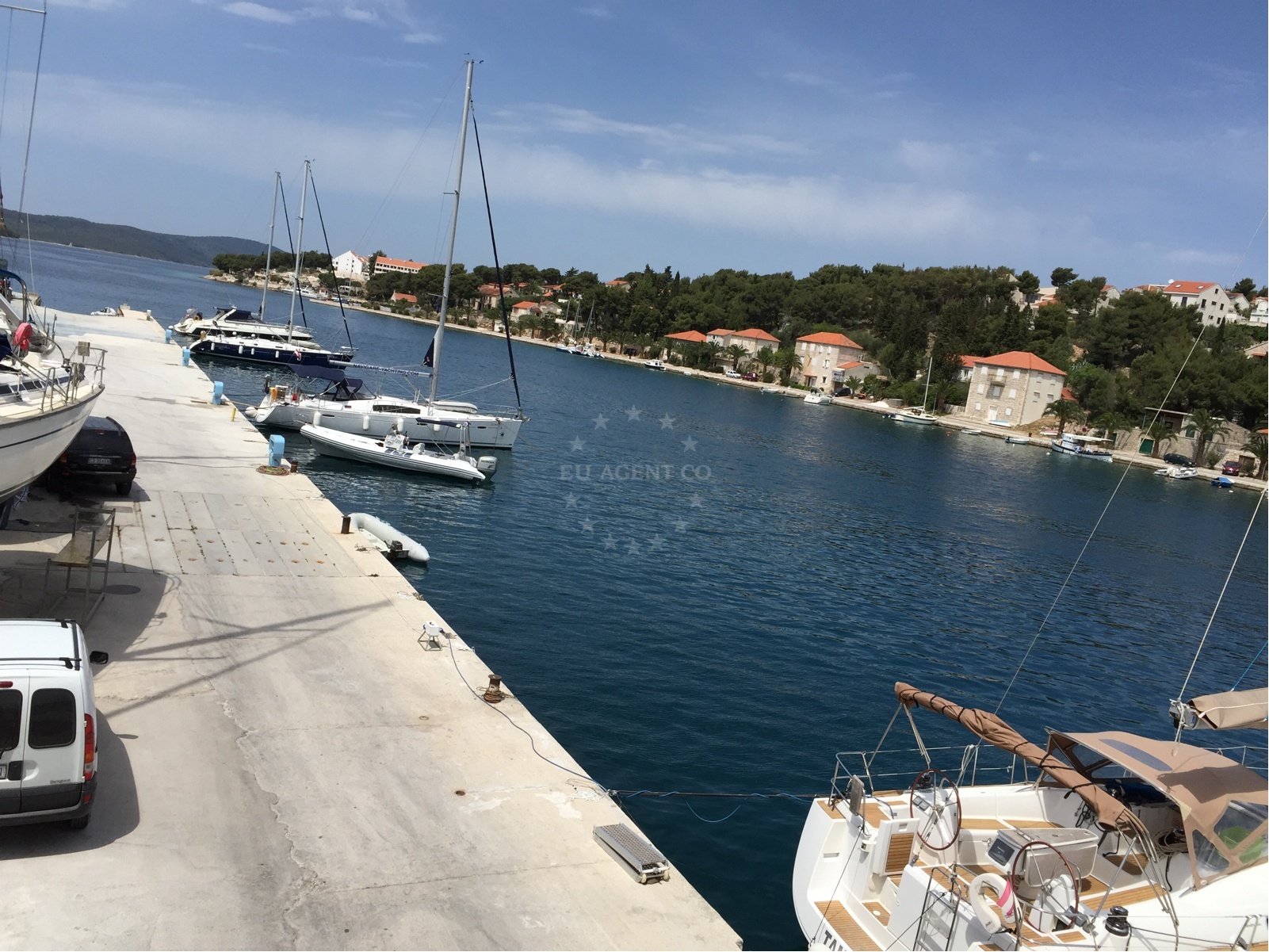 Marina Milna Kanarija, Brač: Docking area with boats and nearby Milna town in the distance.