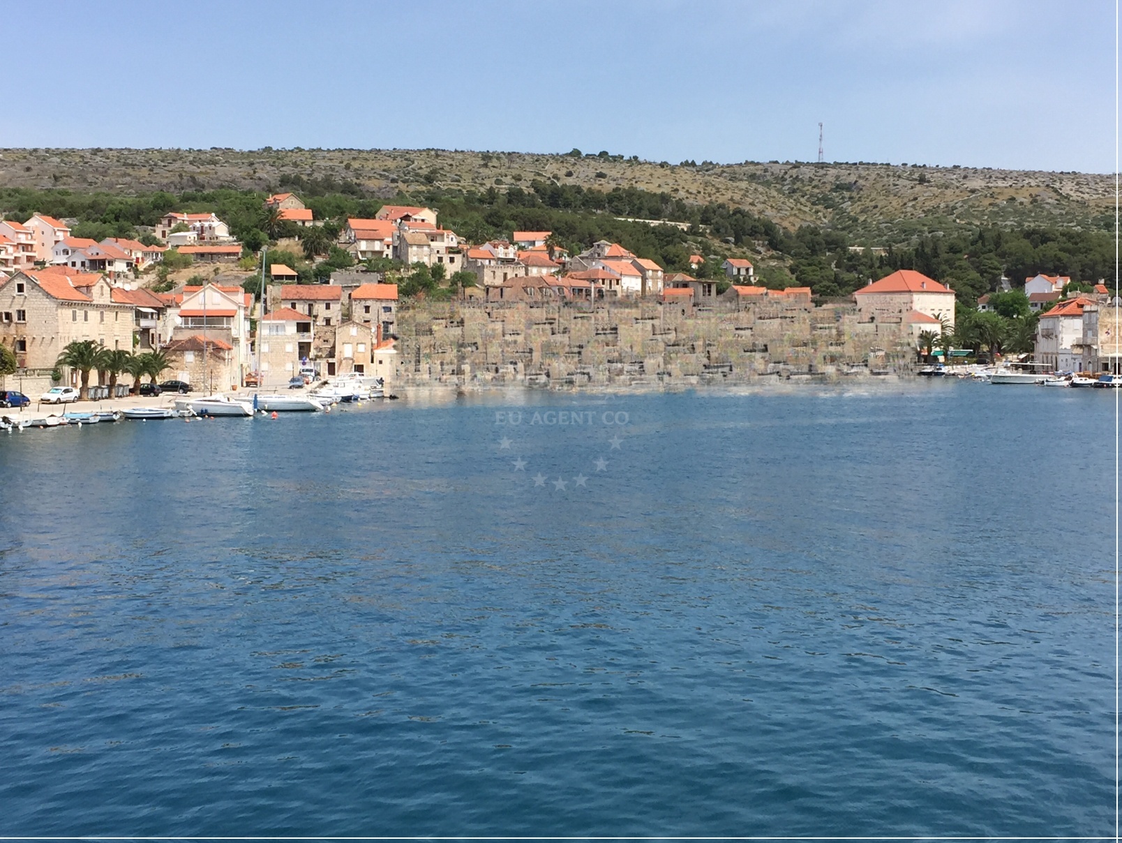 Yachts at Marina Milna Kanarija, Brač: Close-up of mooring facilities with Adriatic Sea views.