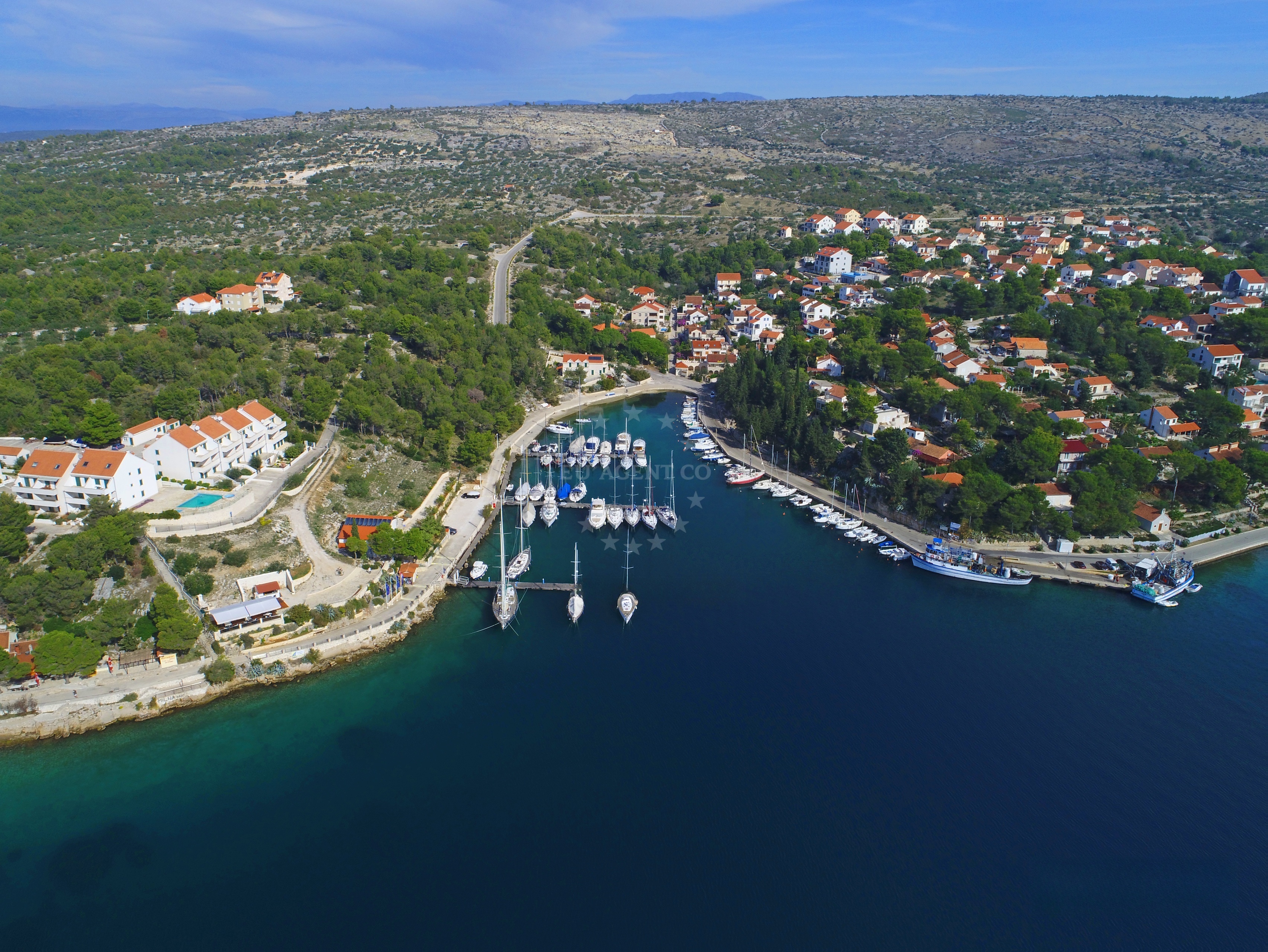 Marina Vlaska in Milna, Brac, Croatia with pine forest backdrop