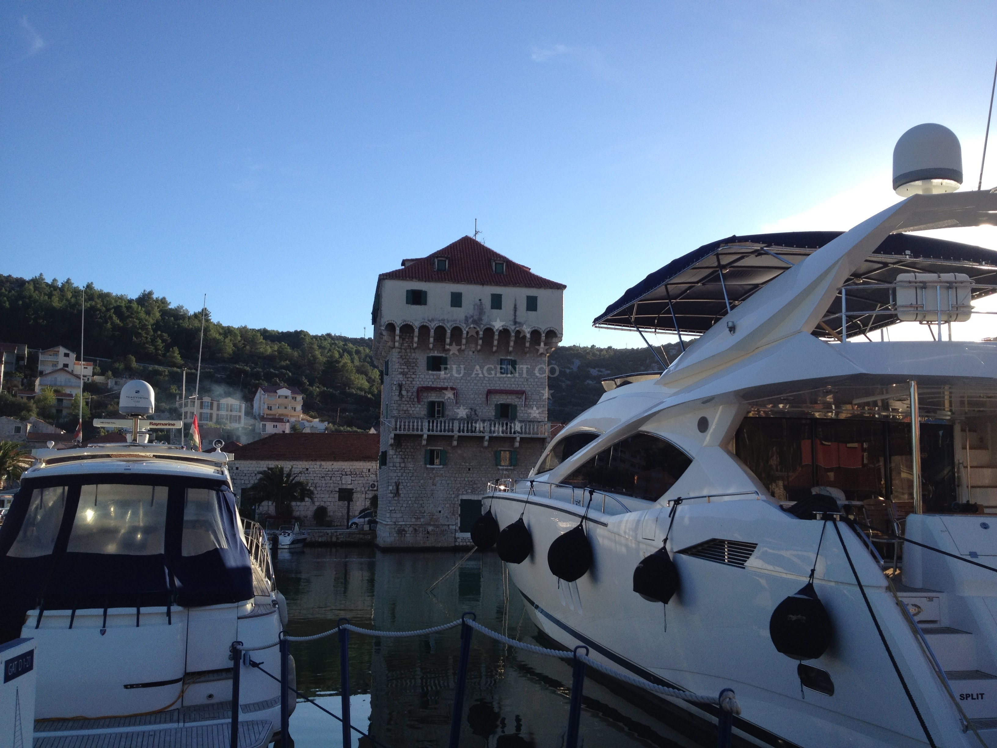 Boats at Marina Agana with nearby beaches in the distance