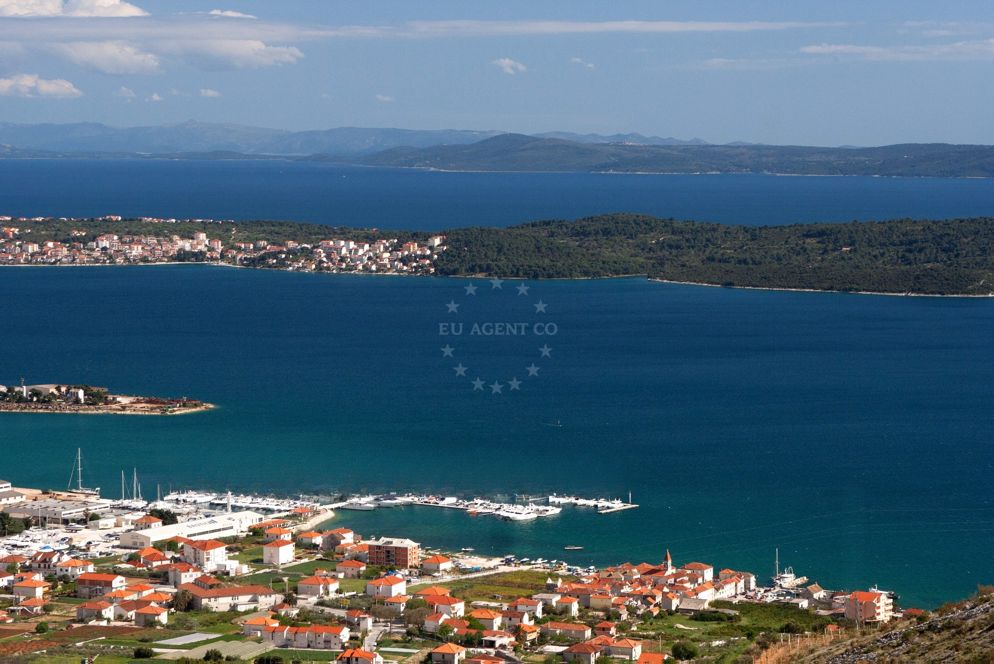 Marina Baotic in Trogir, Croatia, with yachts moored alongside the jetty.