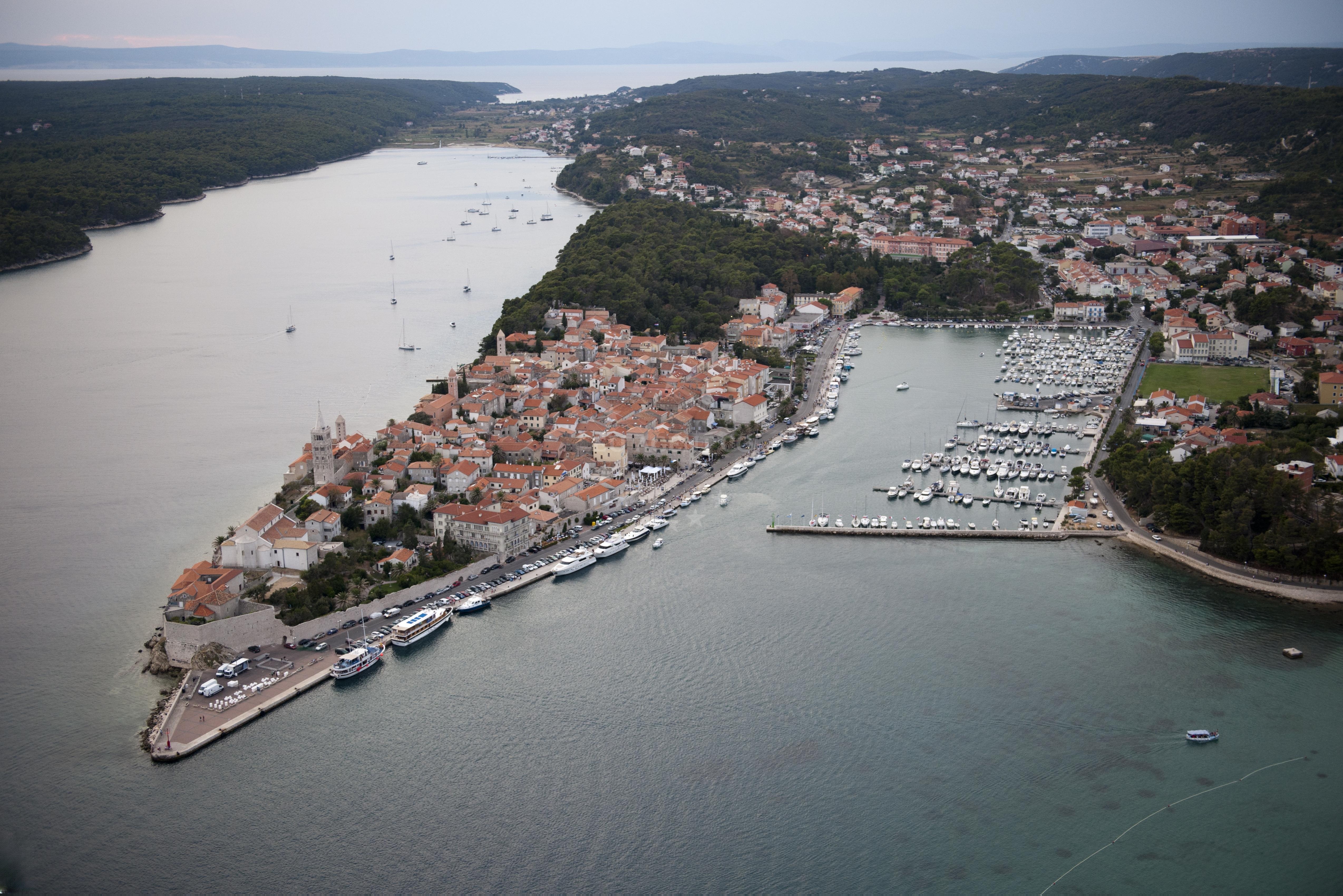 Historic Rab town walls visible from marina