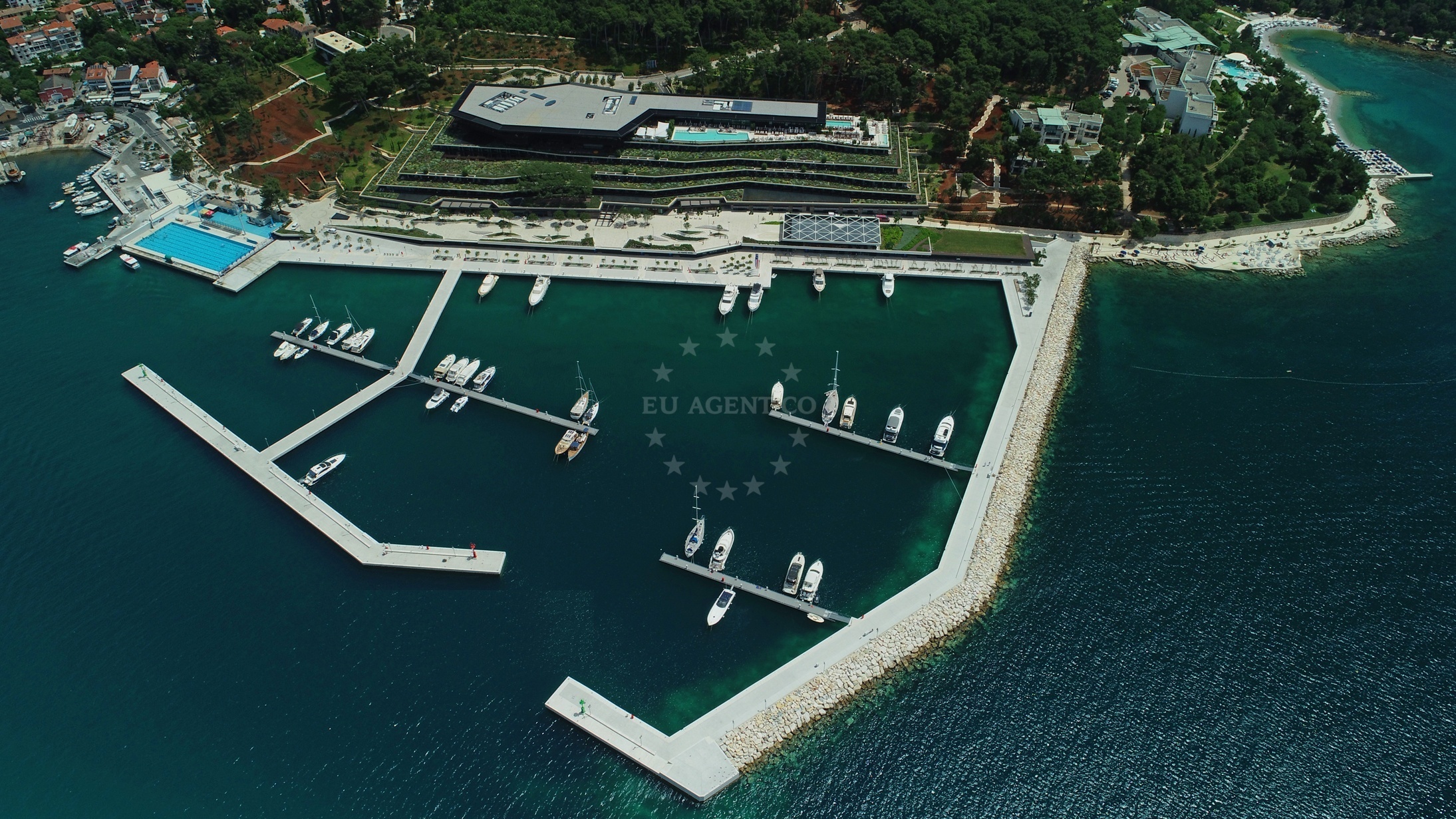 Berth at ACI Marina Rovinj, Croatia: A motor yacht docked with the marina’s facilities visible.