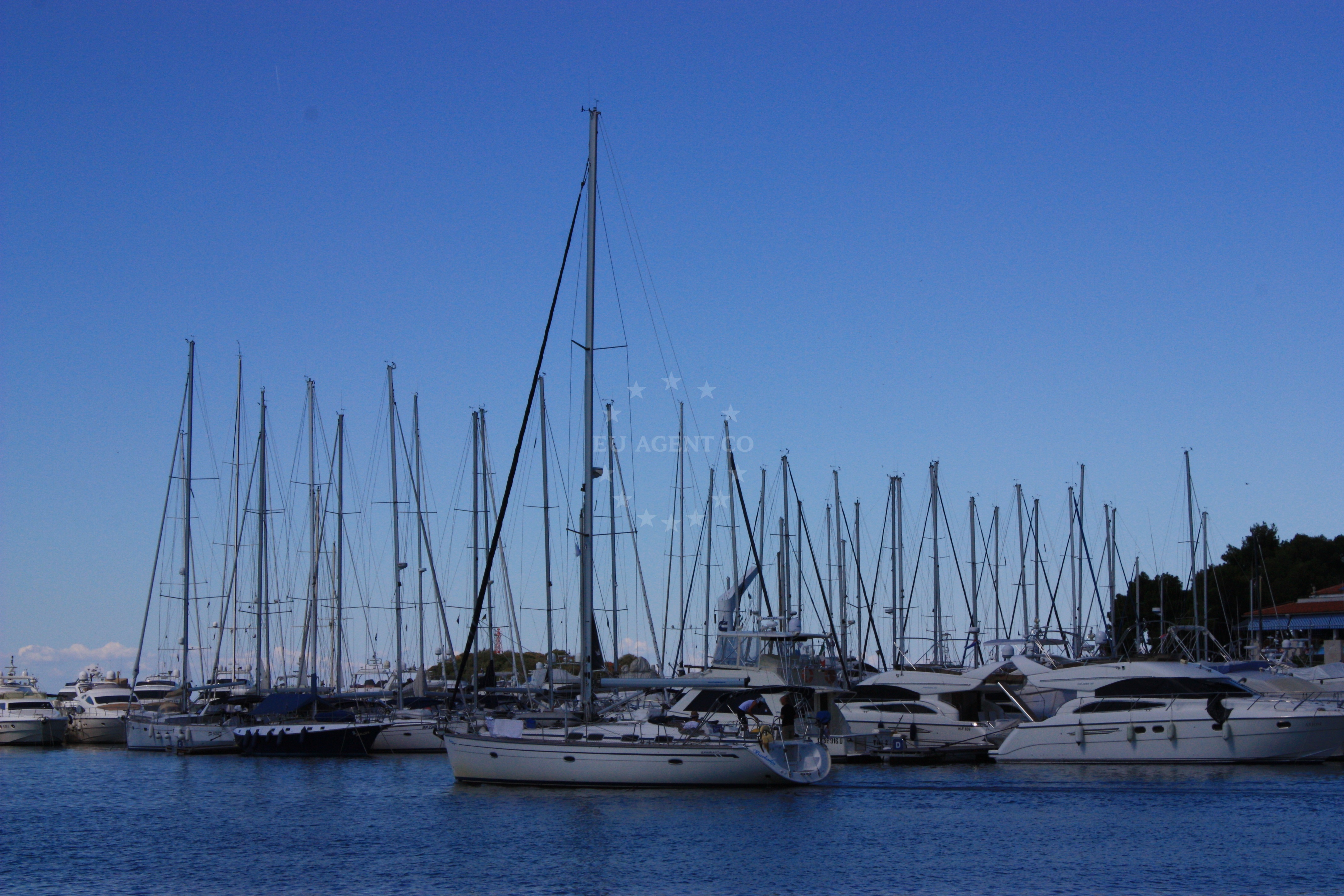 Yachts docked at Marina Vrsar with views of St Juraj Island