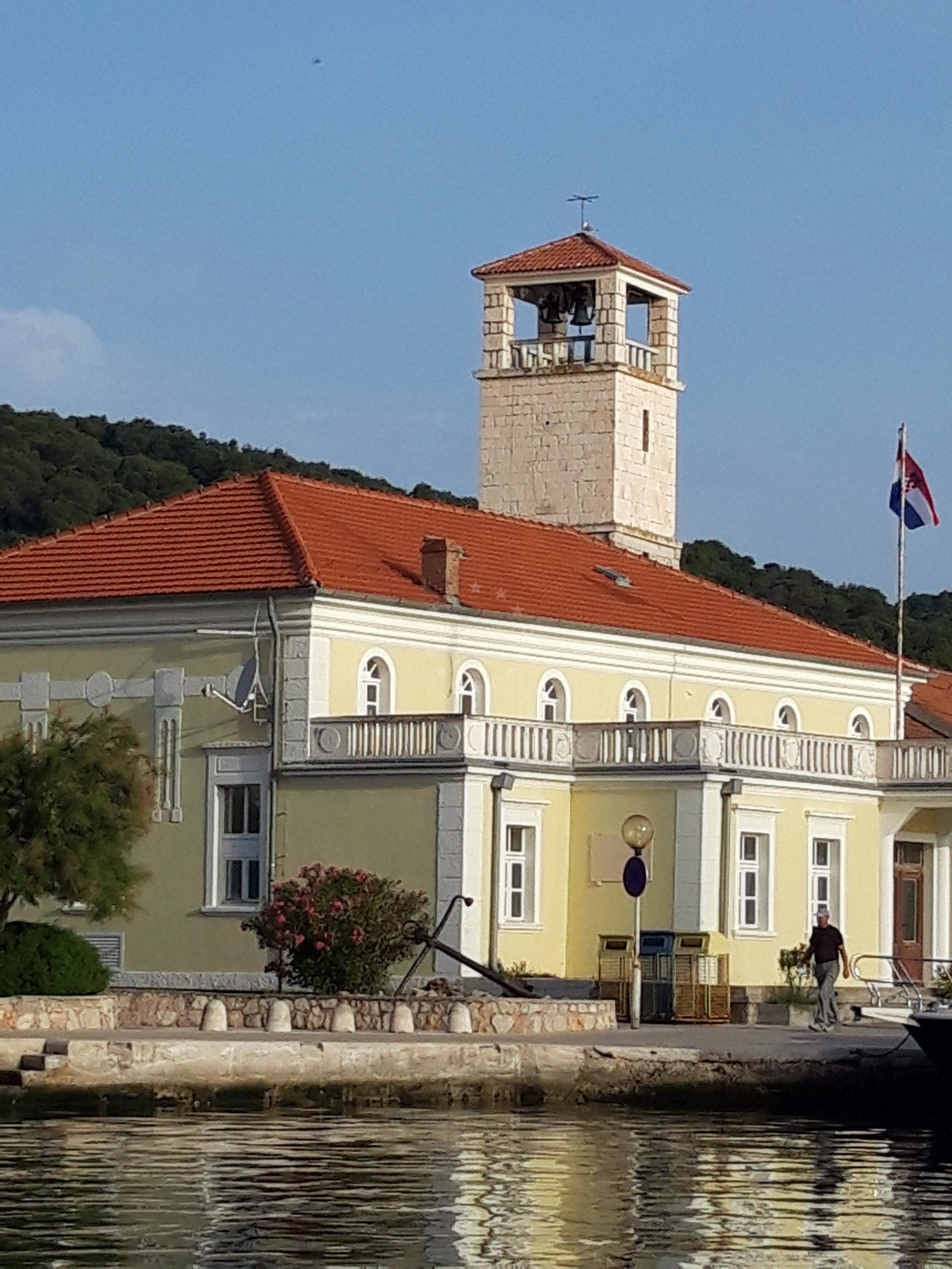 Marina Veli Iz entrance with red li (lighthouse) in the distance