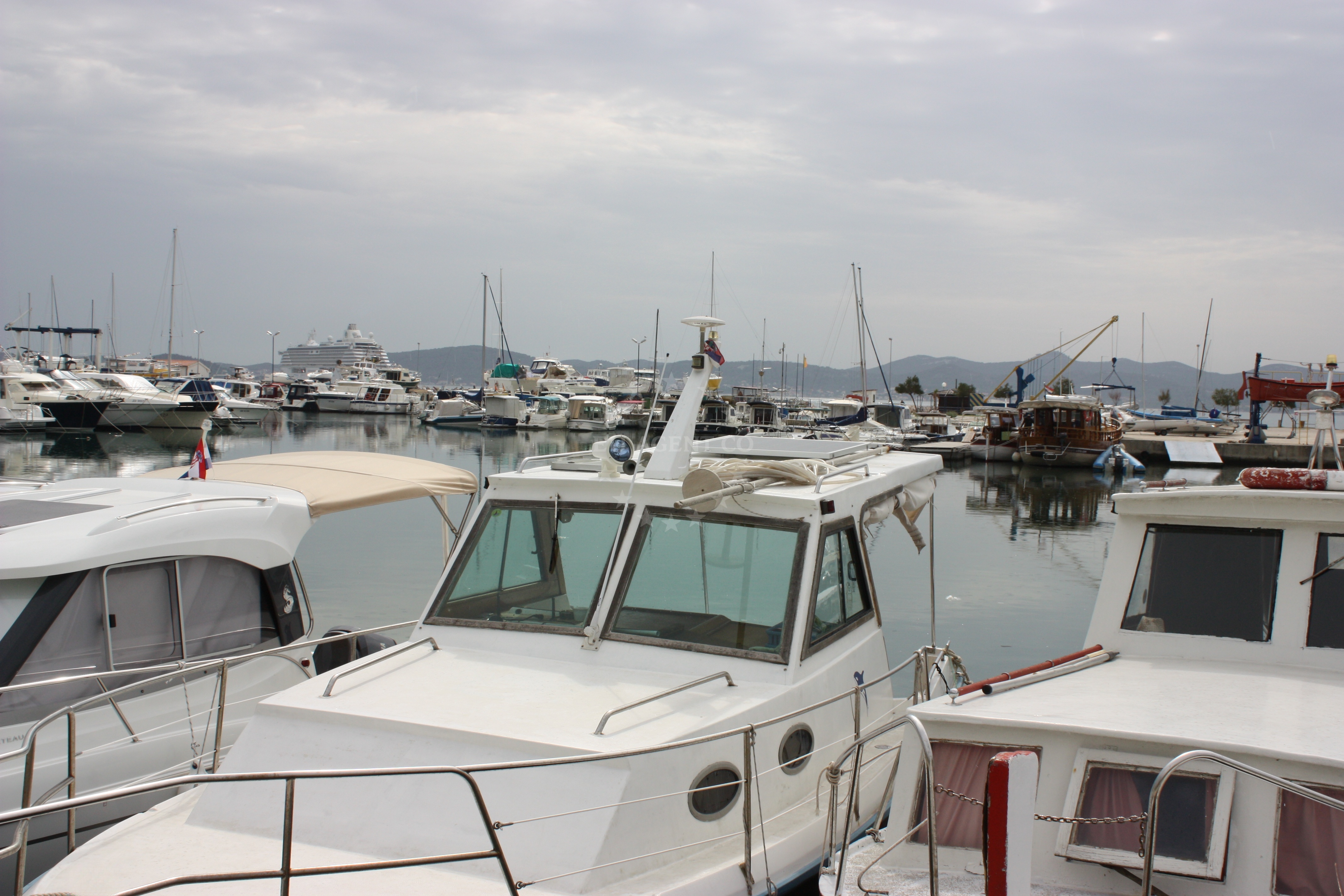 View of the marina from the water with the Kornati Islands in the distance