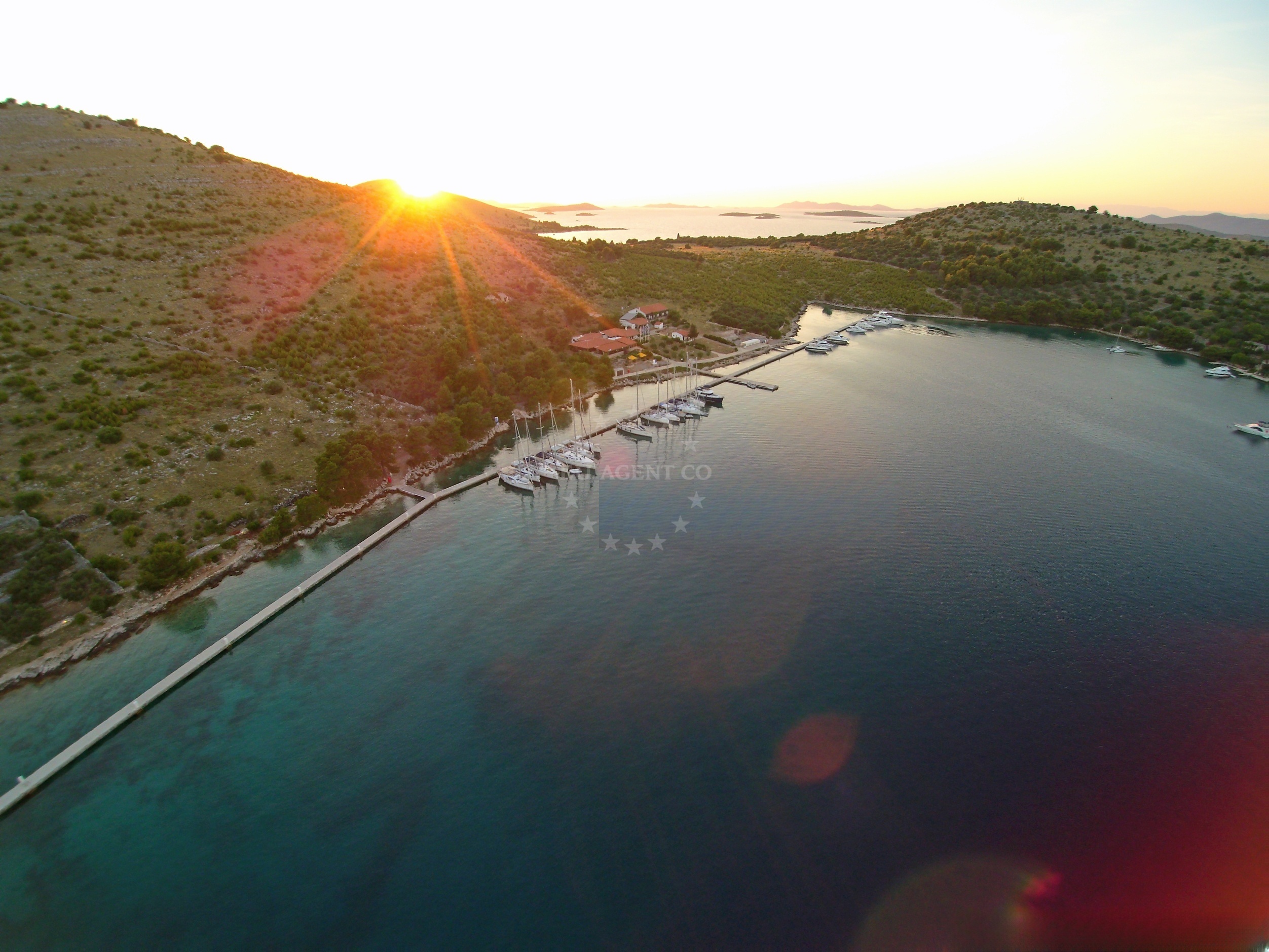 View of ACI Marina Zut from the water, surrounded by the Kornati archipelago