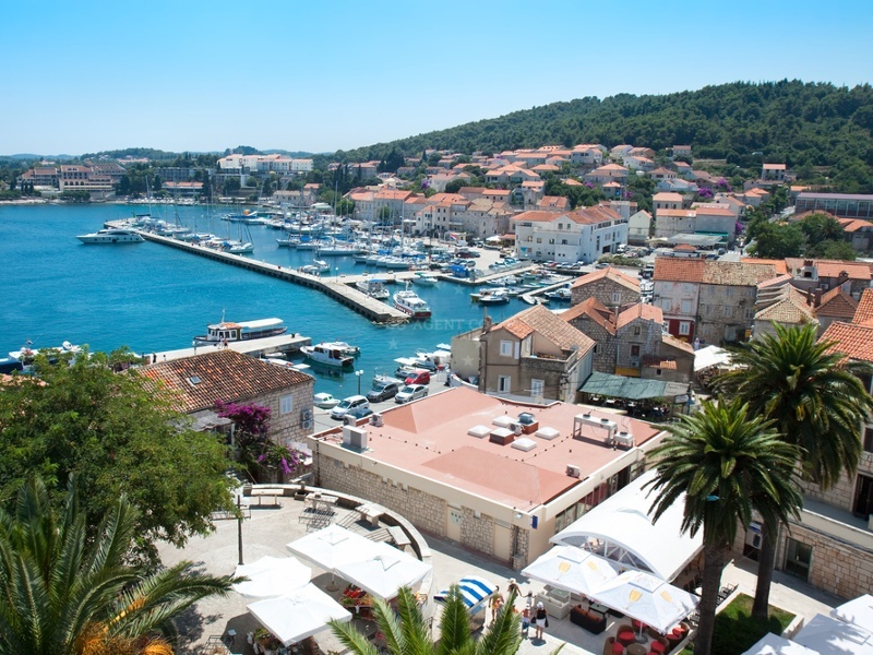 Marina entrance with mooring buoys and nearby beaches visible