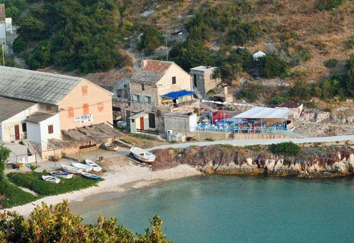 Dining area at Tomic Restaurant, showcasing traditional Croatian seafood dishes and island views.