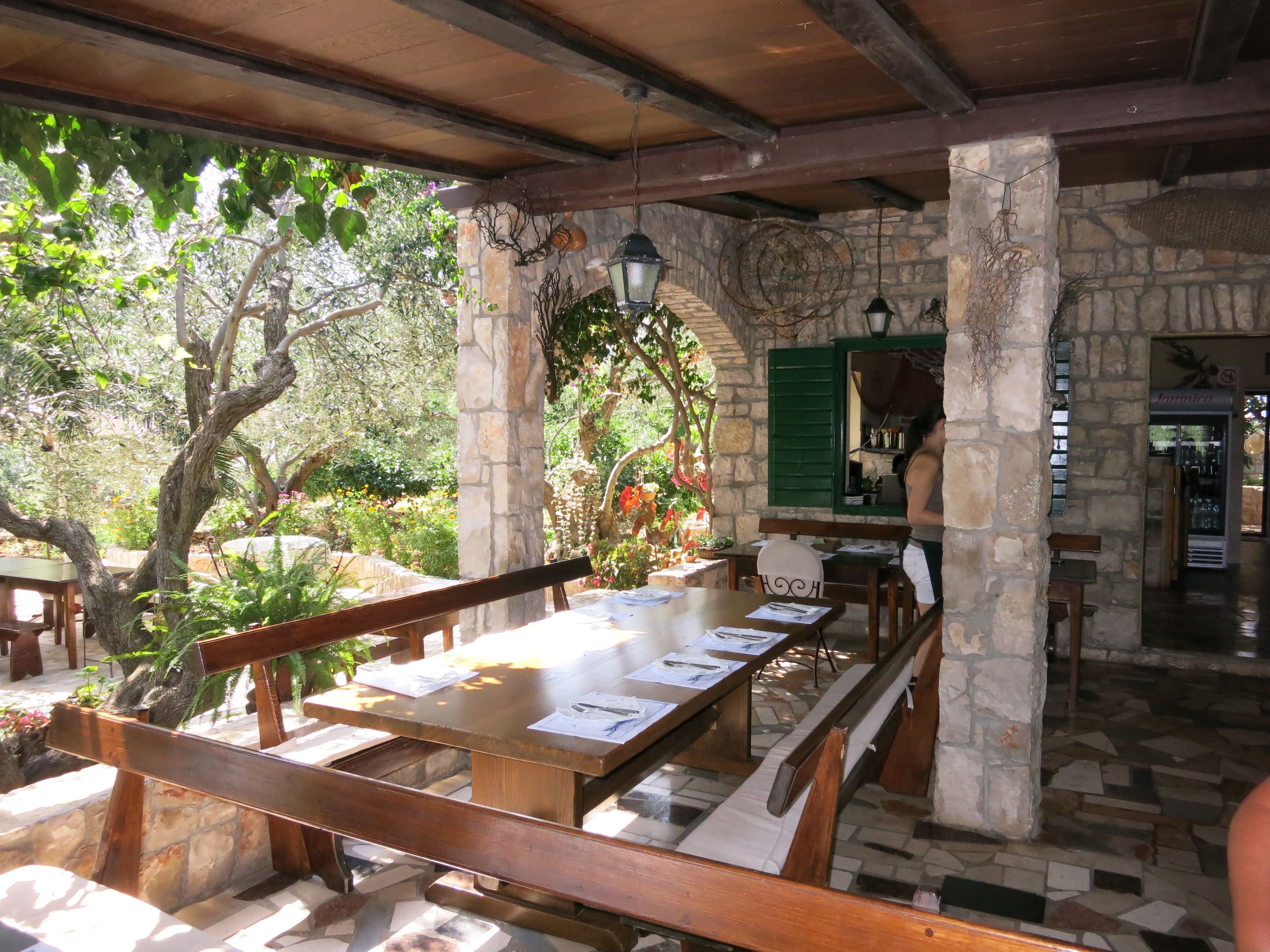 Konoba Krknjasi restaurant in a garden on Drvenik Veli Island, Croatia