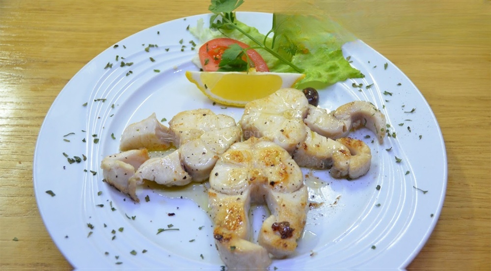 Handmade olive oil bottles and organic produce displayed at Restaurant Murvica