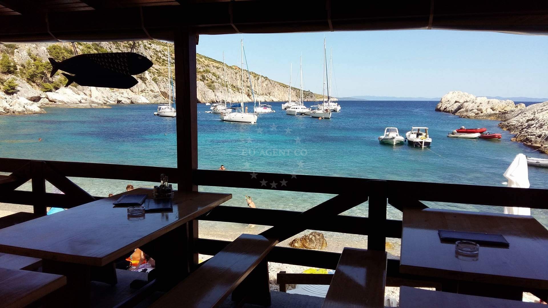 Dining terrace at Gego Restaurant with sunrise view over Zarace Bay