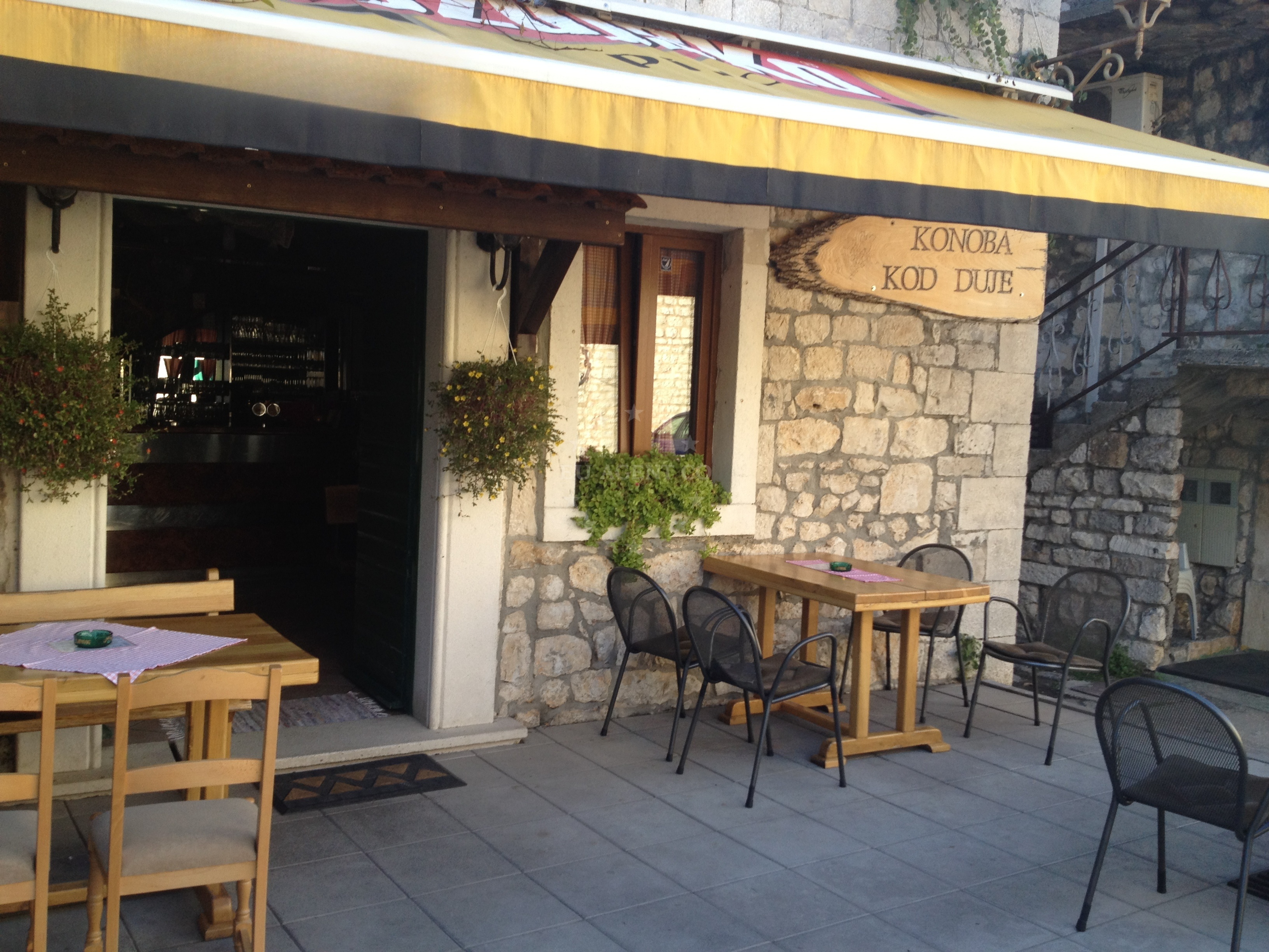 Dining area at Konoba Kod Duje overlooking the Adriatic Sea