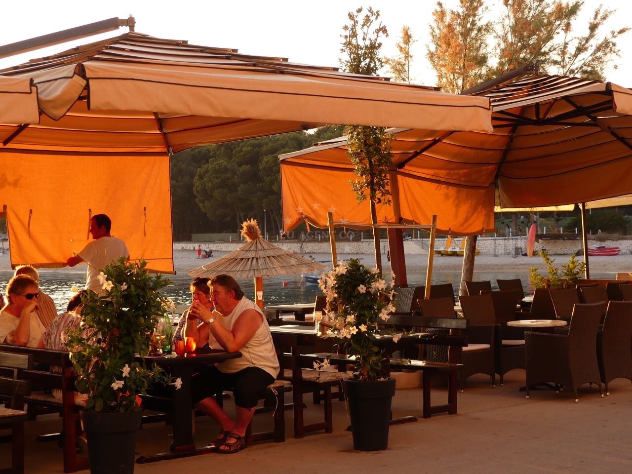 Rustic interior of Restaurant Galija with views of Primosten’s harbor