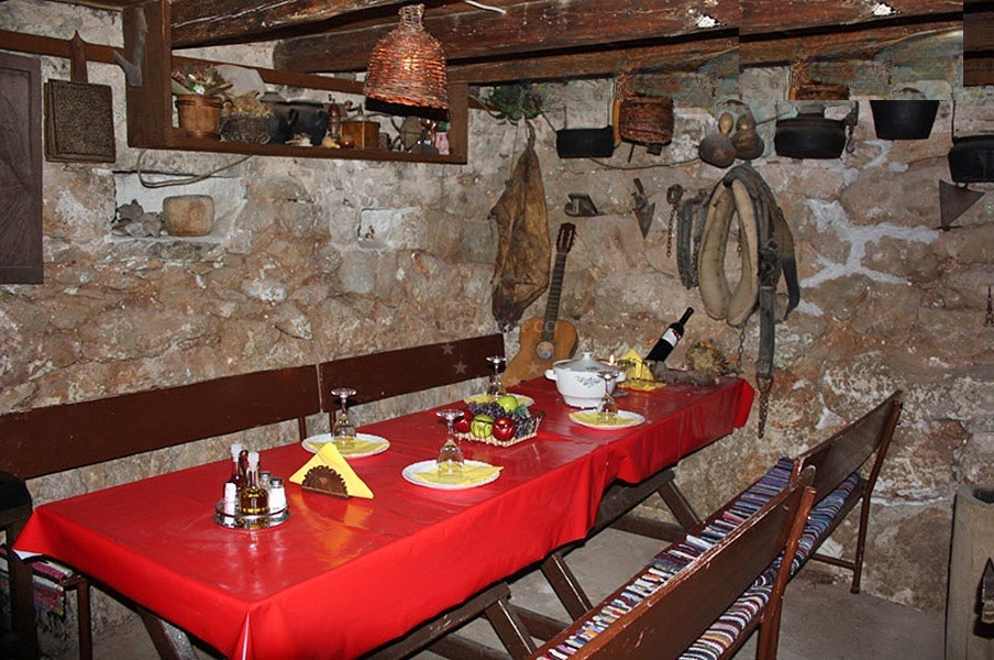 Dining area at Saricevi dvori restaurant overlooking the sea