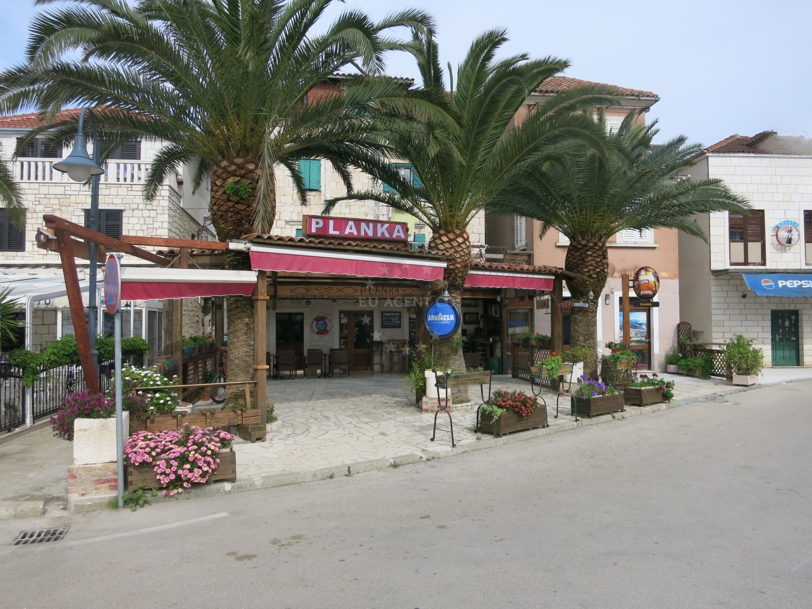 Konoba Planka restaurant in Rogoznica, Central Dalmatia, Croatia, overlooking the Adriatic Sea with marina and anchorage views