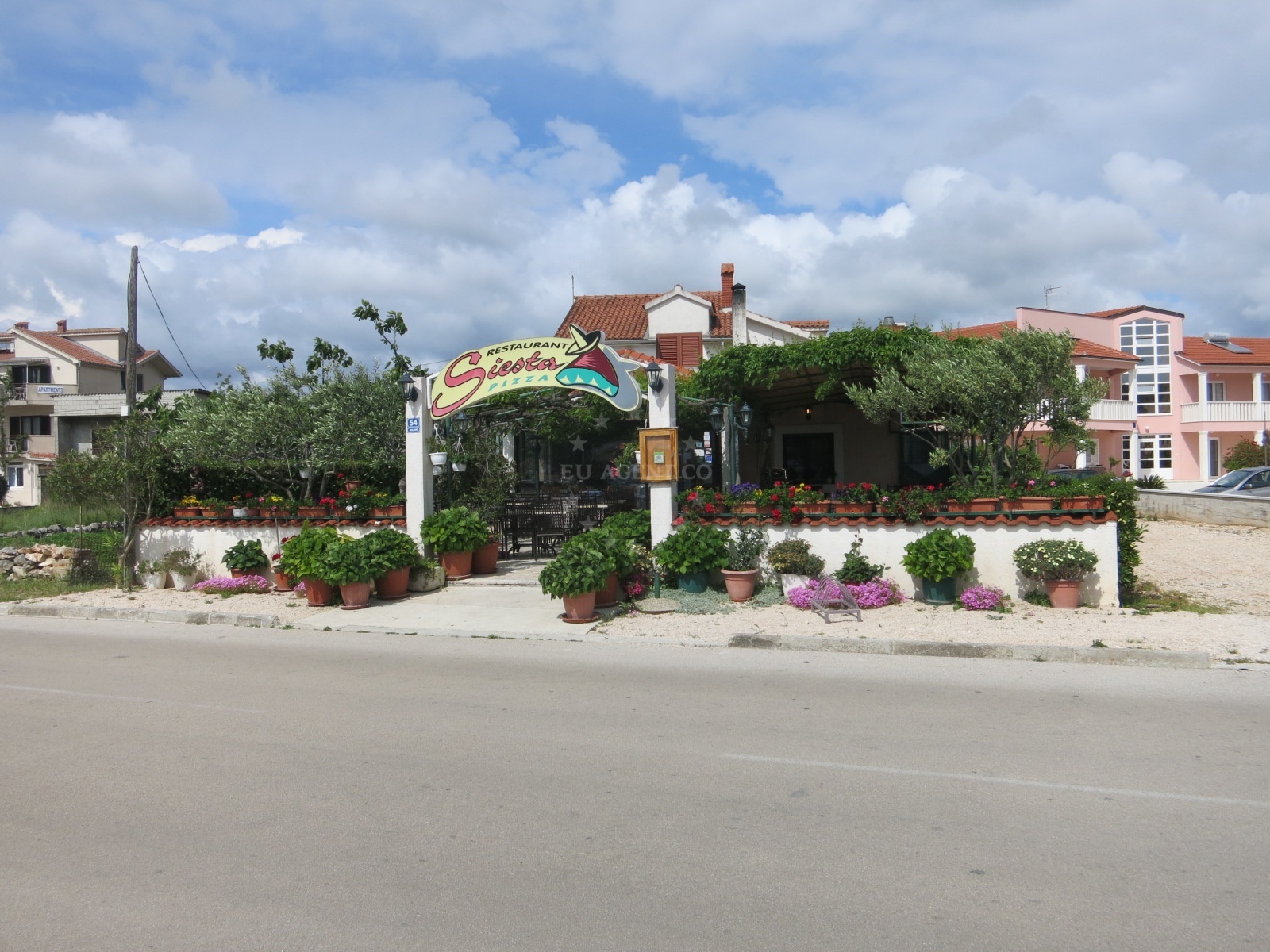 Siesta Restaurant in Rogoznica, Central Dalmatia, overlooking the Adriatic coast with views of nearby marina and beach