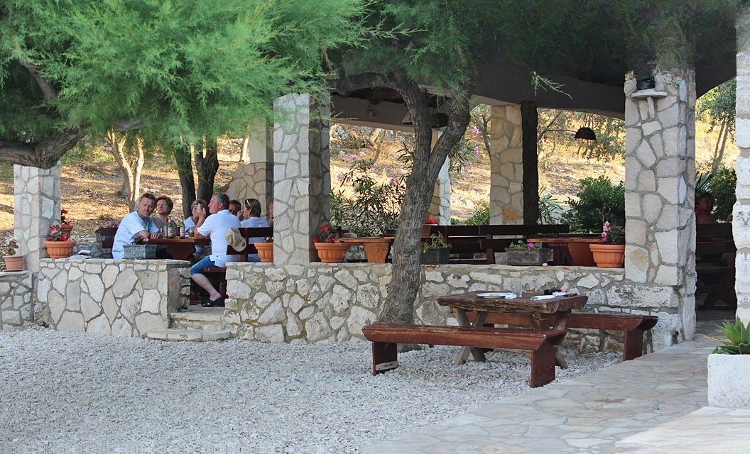 Seating area at Kod Ive Restaurant overlooking the sea