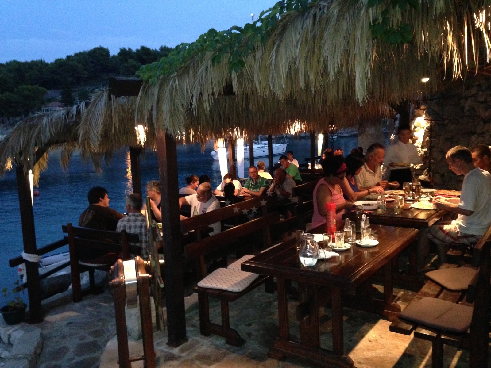 Grilled meat and seafood dishes on display at Pasarela