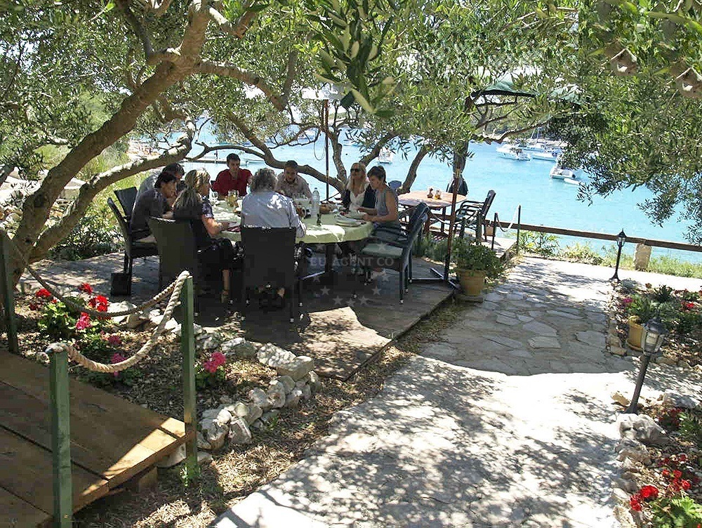 Restaurant terrace with views of St. Klement Island and nearby yachts