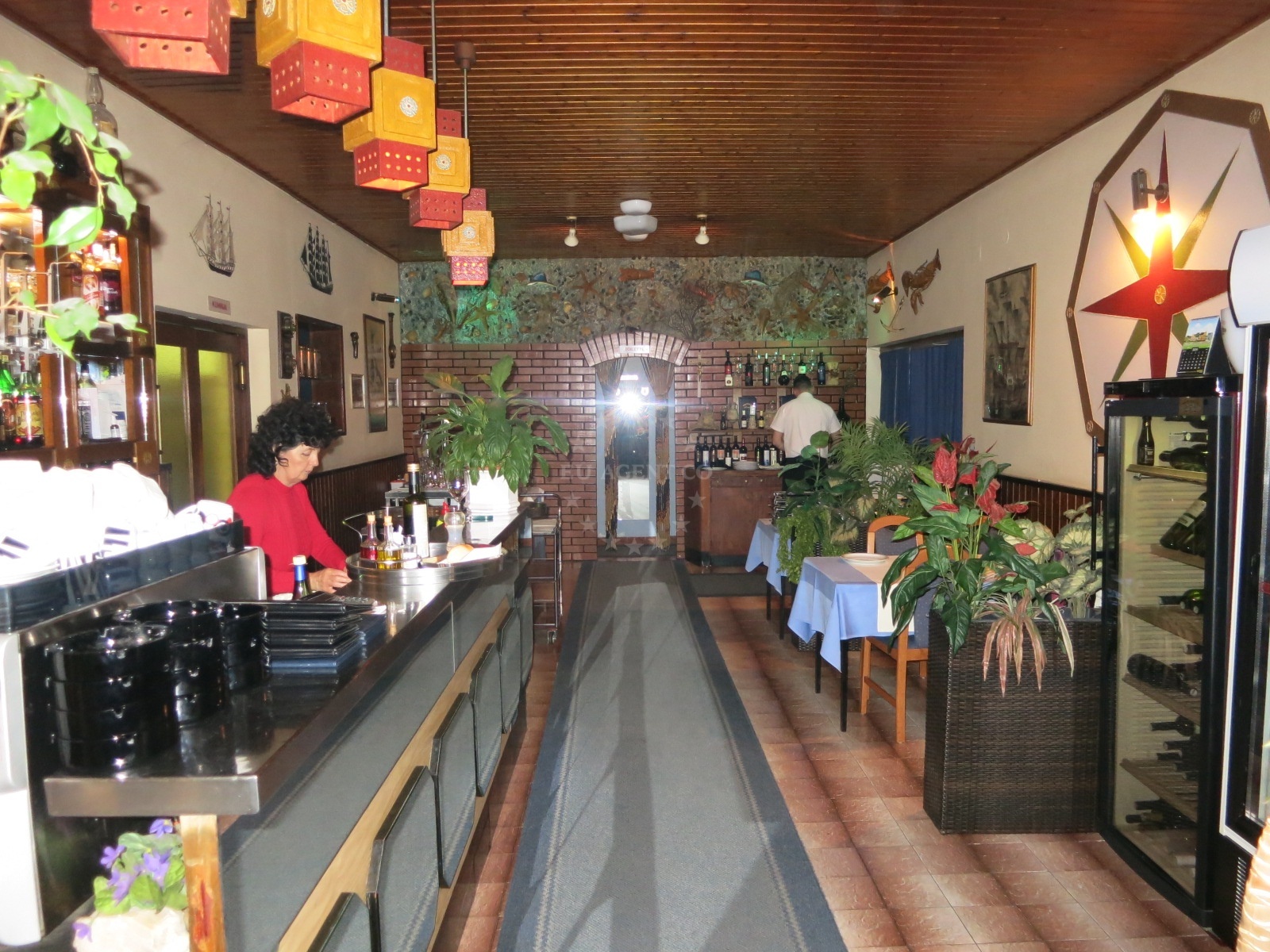 Dining area at Barba Restaurant, Trogir, with views of the sea and nearby marina